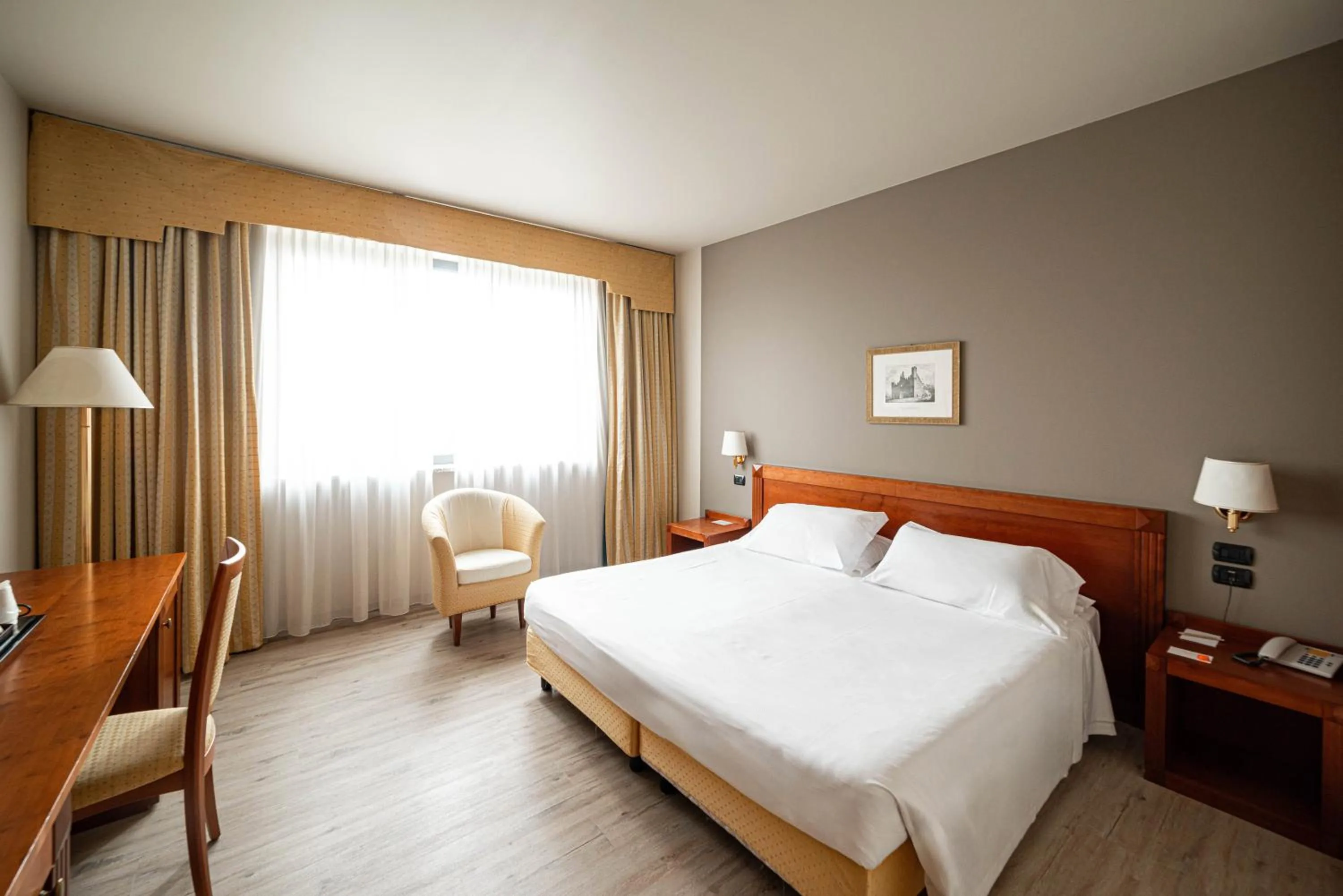 Bed in Phi Hotel Cavalieri