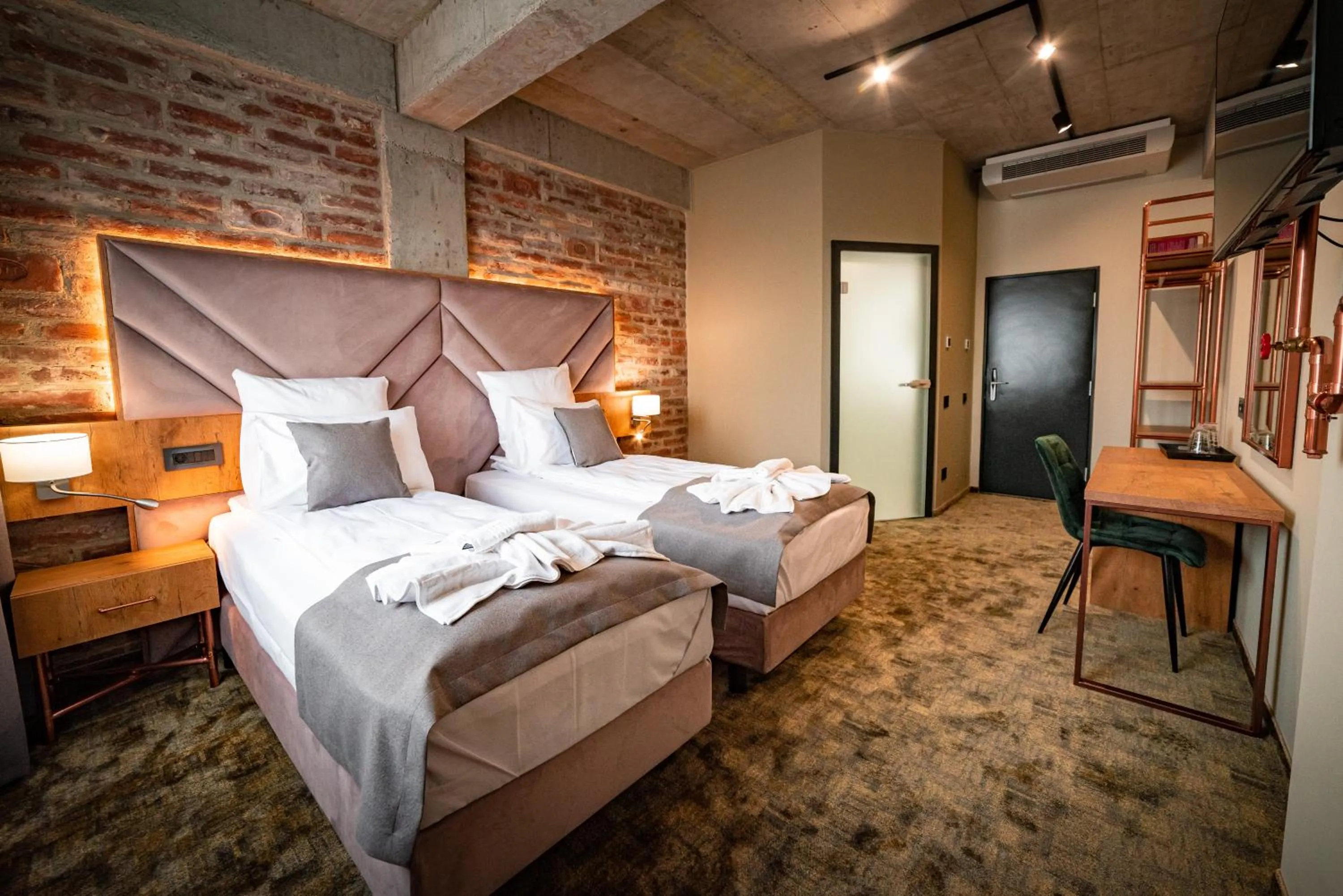 Bed in Mustang Boutique Rooms