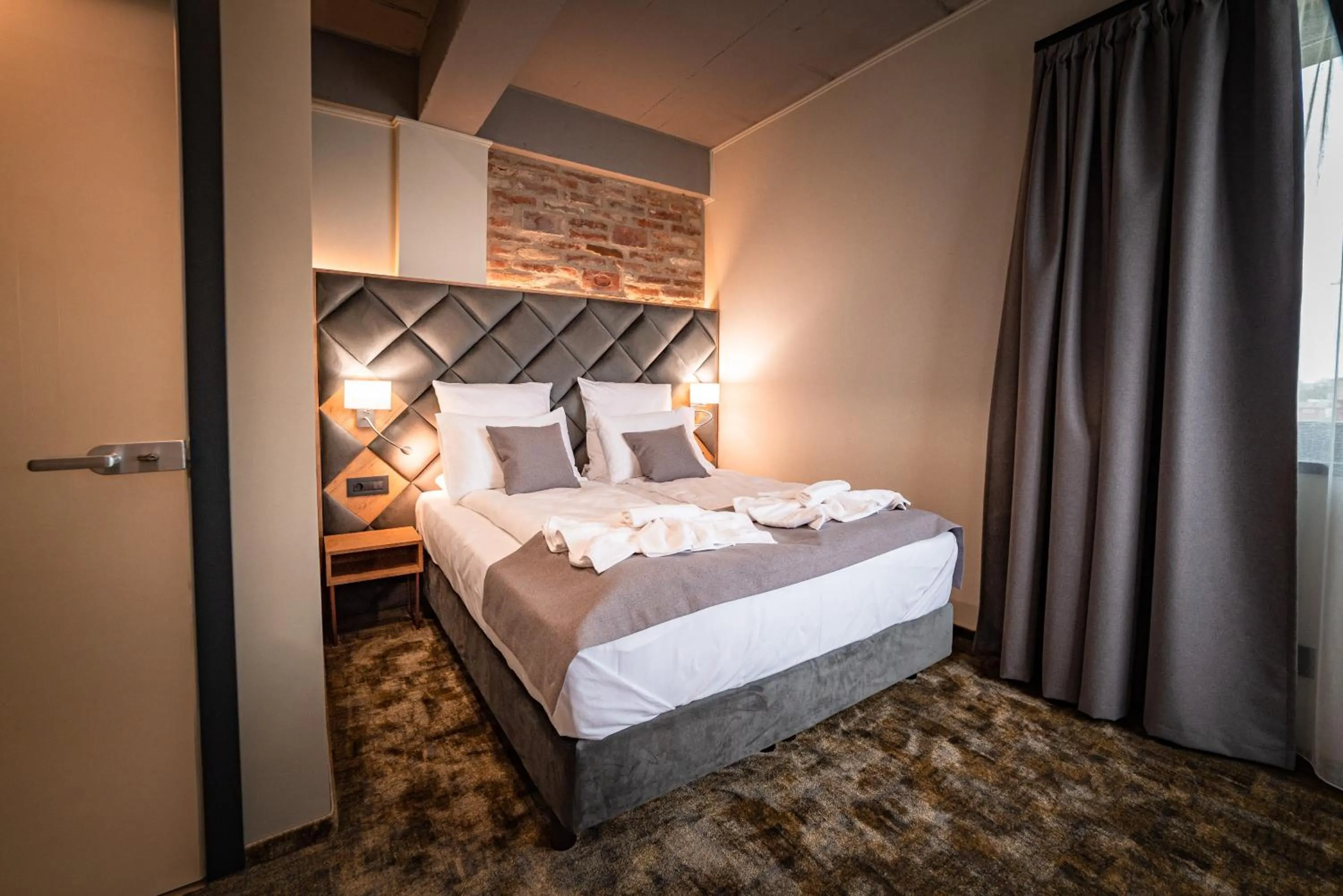 Bed in Mustang Boutique Rooms