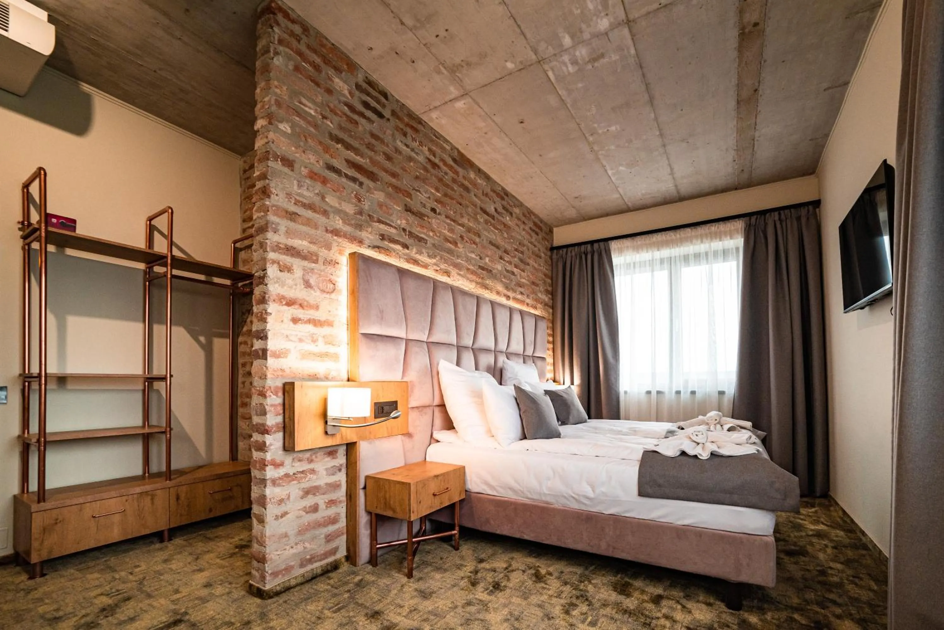 Bed in Mustang Boutique Rooms