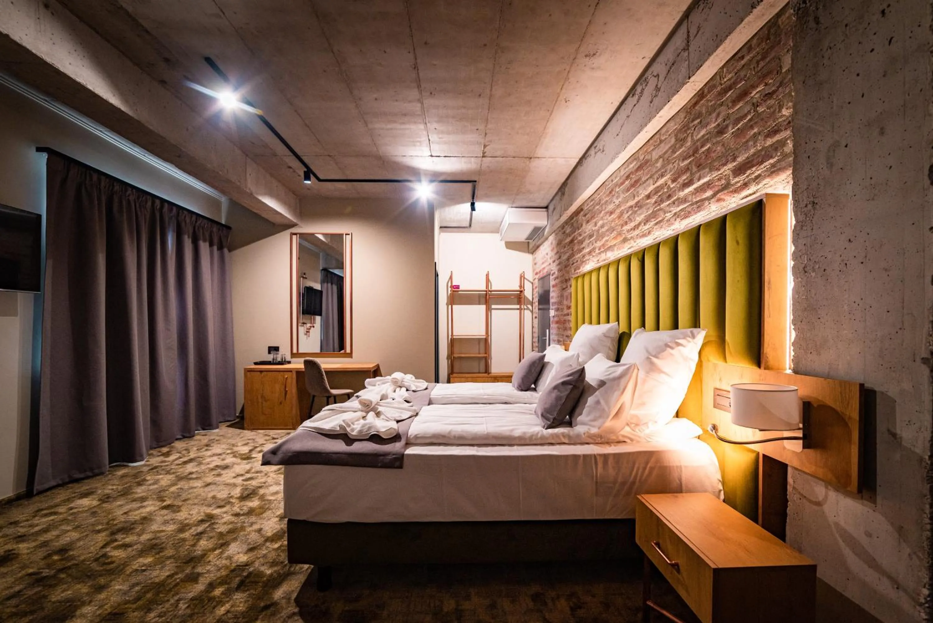 Bed in Mustang Boutique Rooms