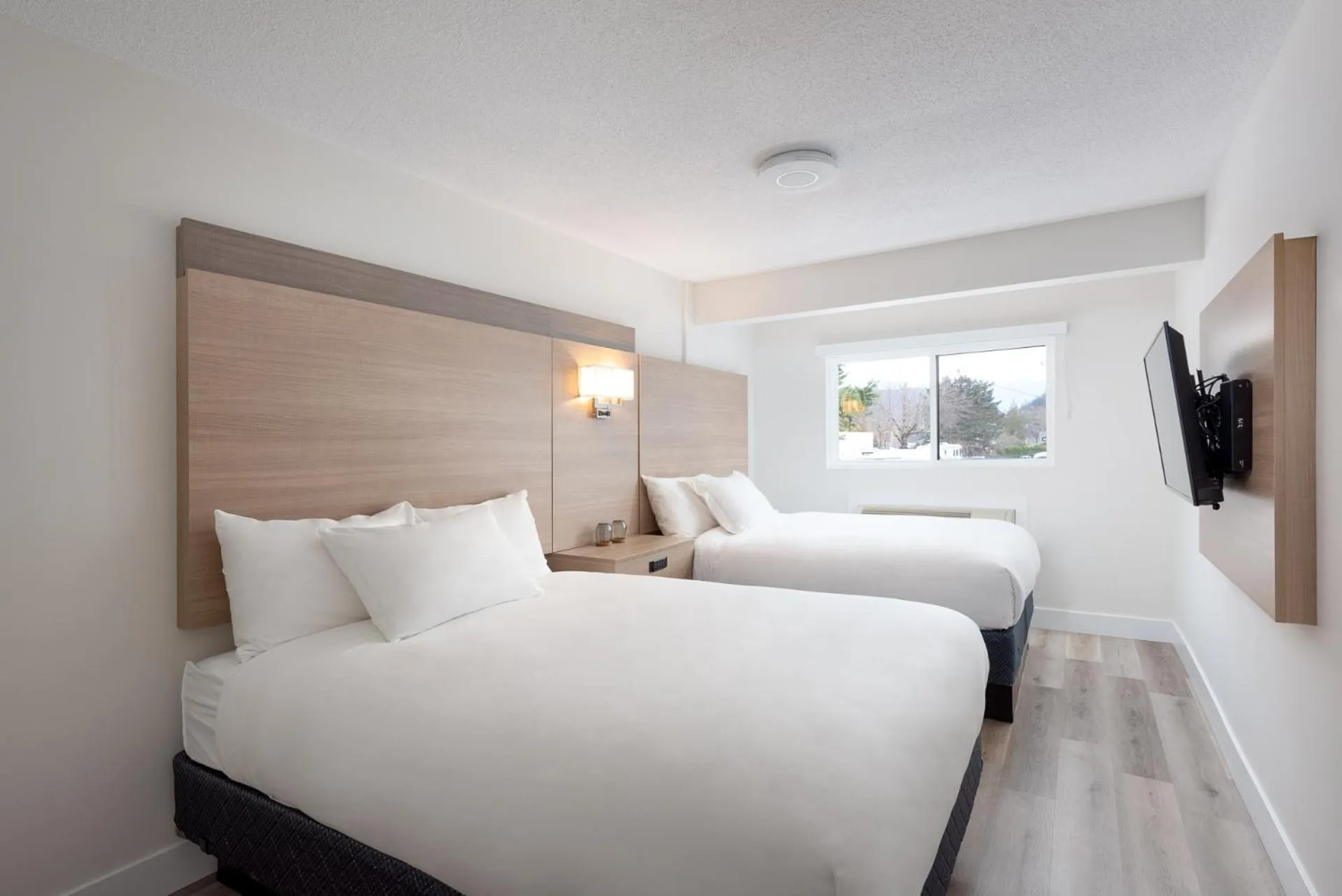 Bed in Harrison Grand Motel