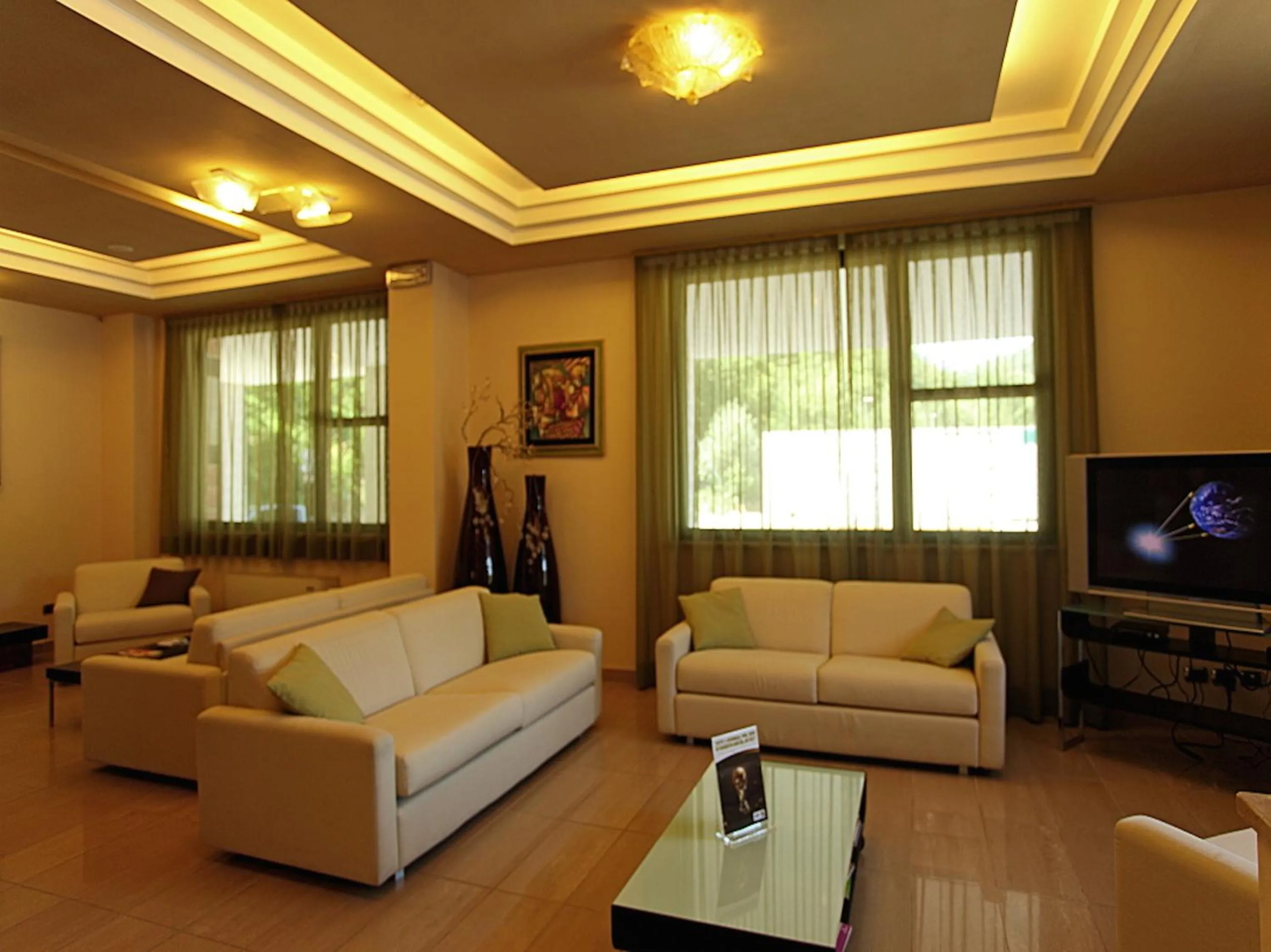 Communal lounge/ TV room in Euro Hotel