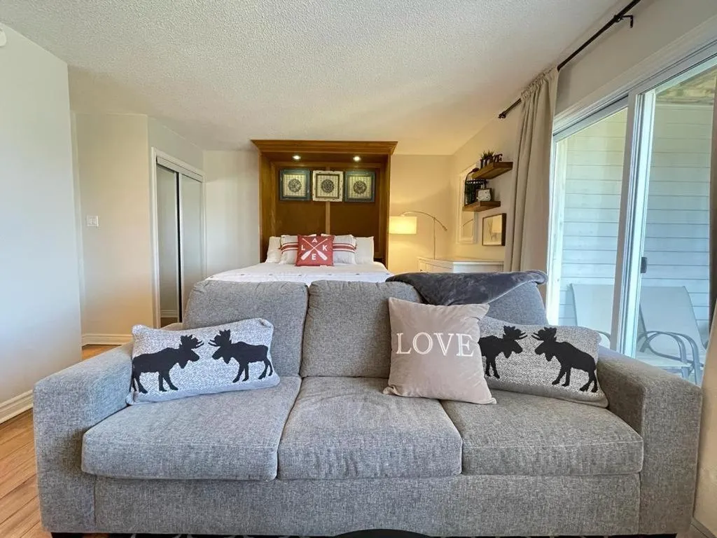 Bed in Modern Mountainside Ski In/Ski Out Studio at Blue