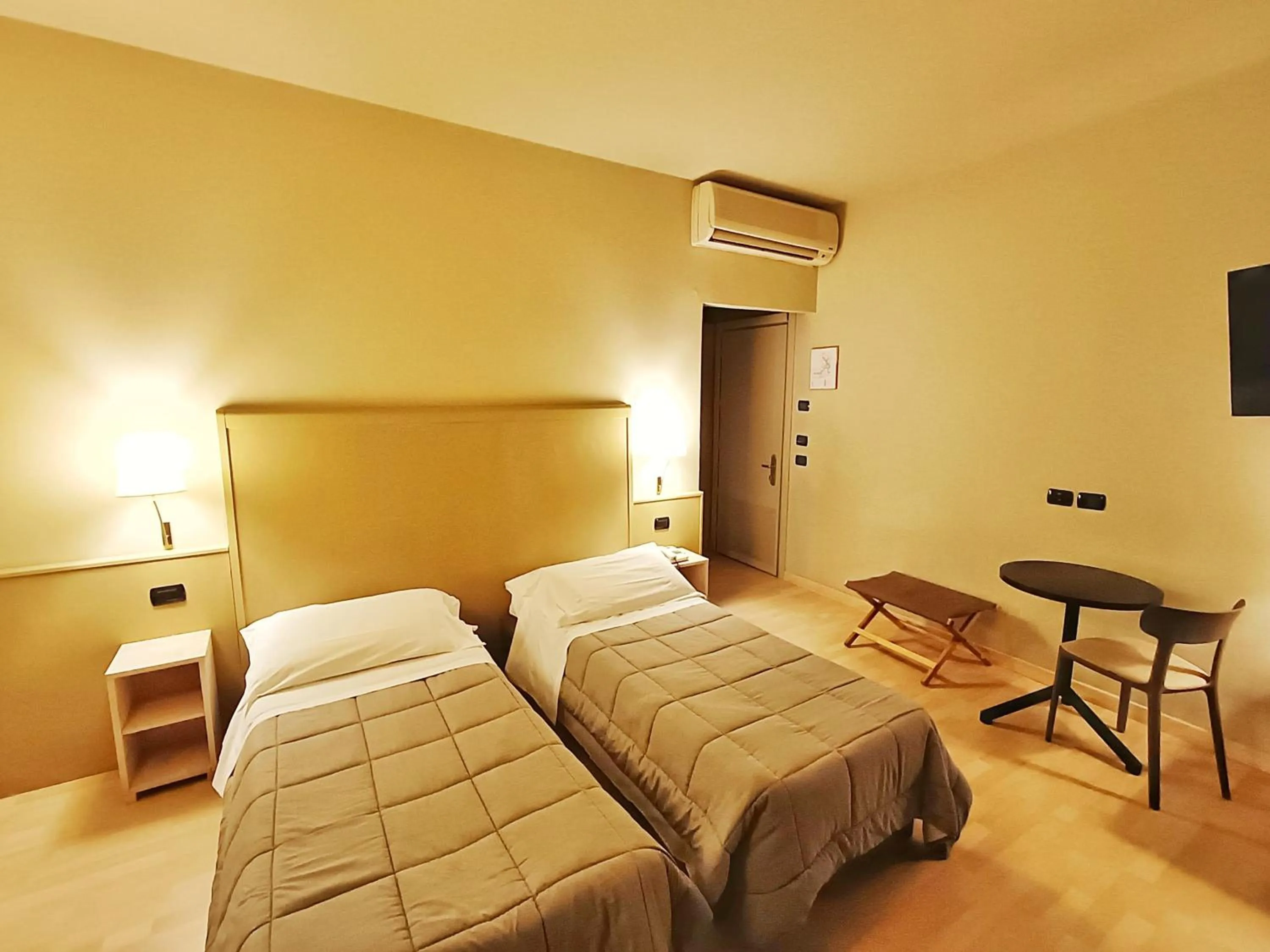 Bed in Hotel Corallo Rimini