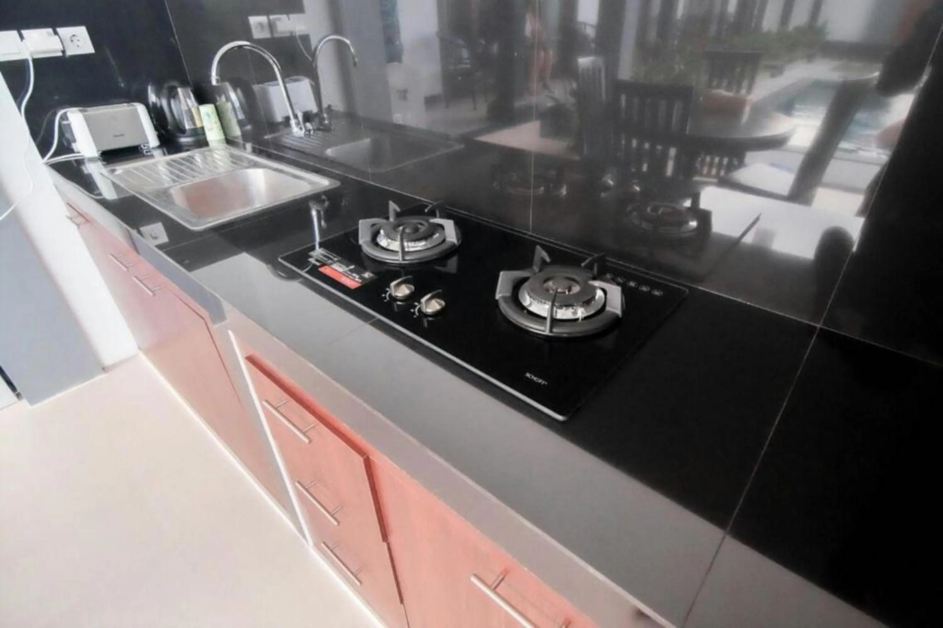 Kitchen or kitchenette in Carik Bali Guest House Canggu