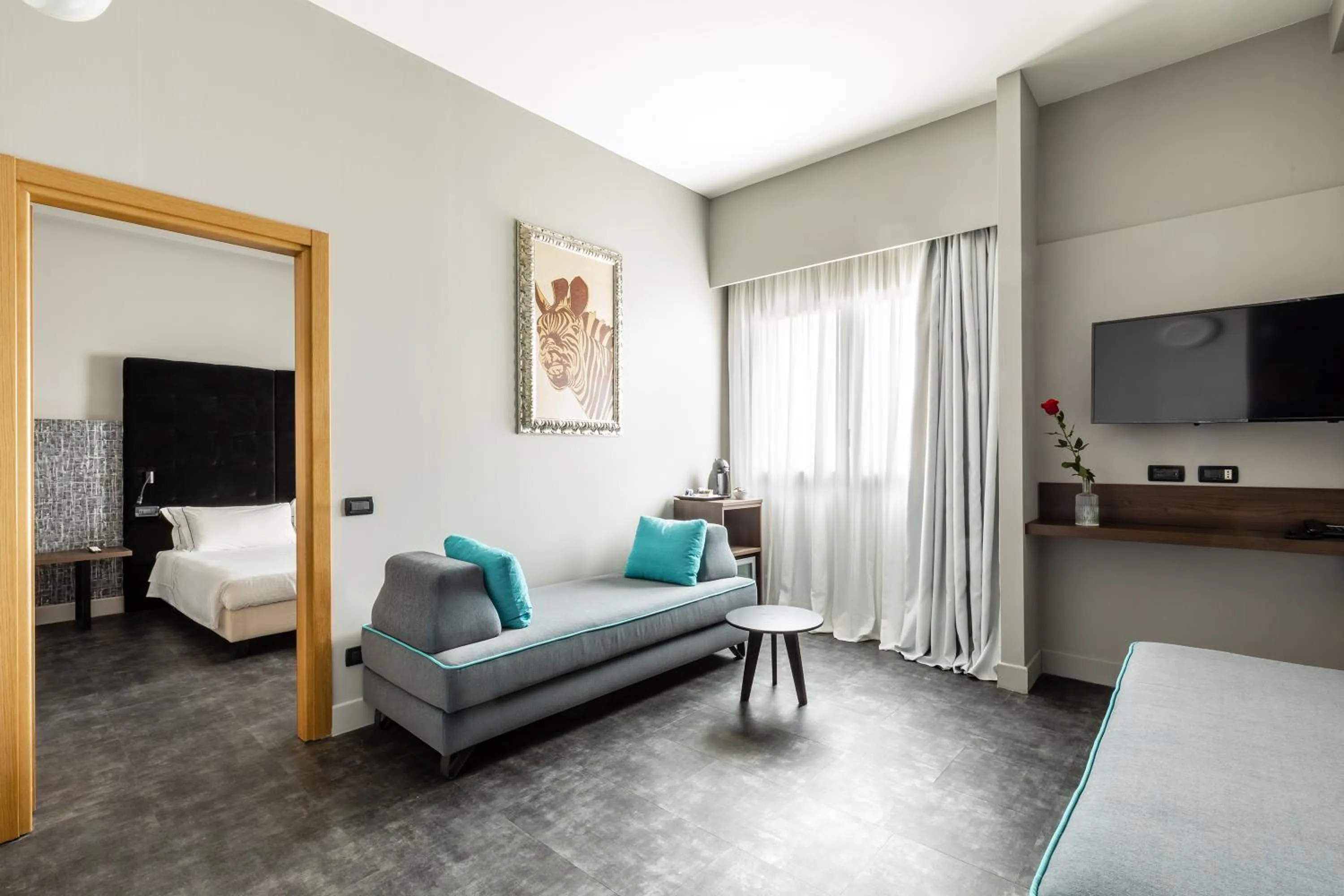 Communal lounge/ TV room, Bed in Anusca Palace Hotel