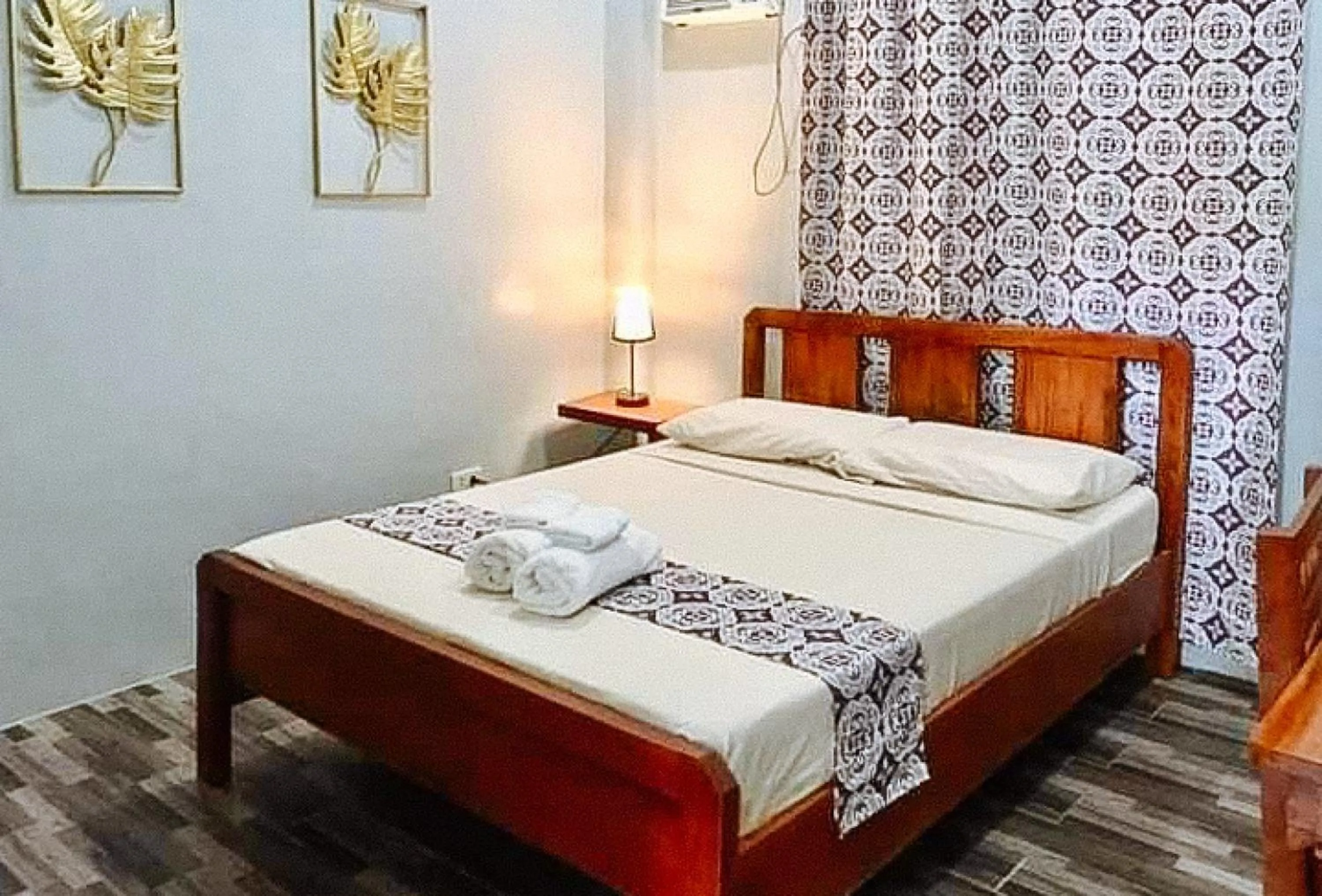 Bed in RedDoorz at Gracia's Calzada Inn Camiguin