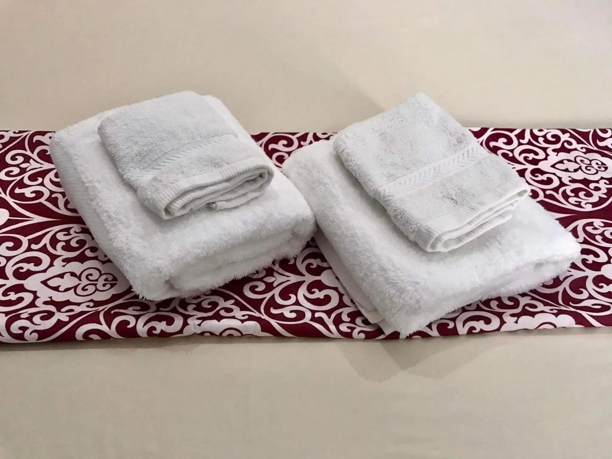 towels in RedDoorz at Gracia's Calzada Inn Camiguin