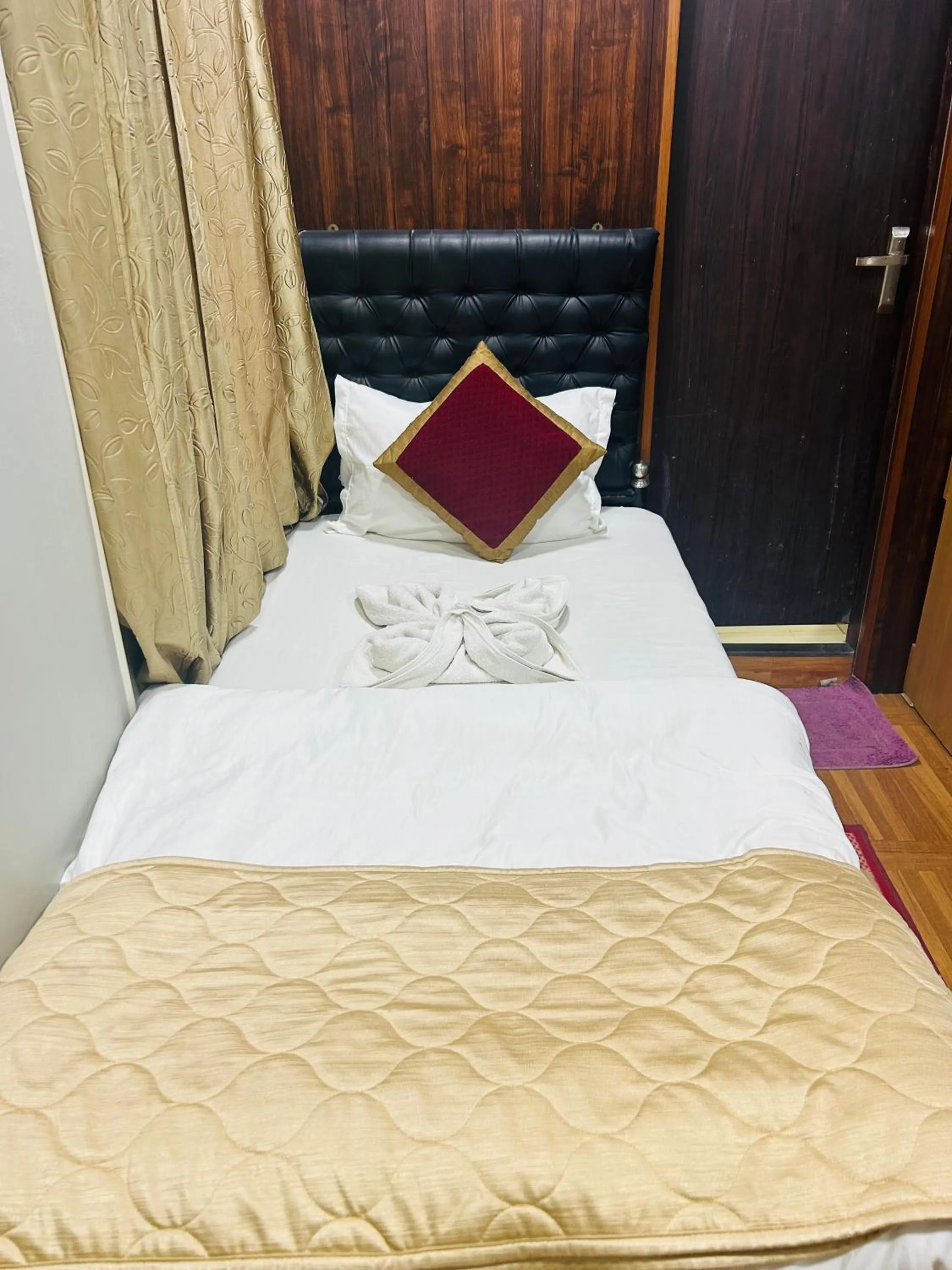 Bed in HOTEL MITTAL GARDEN