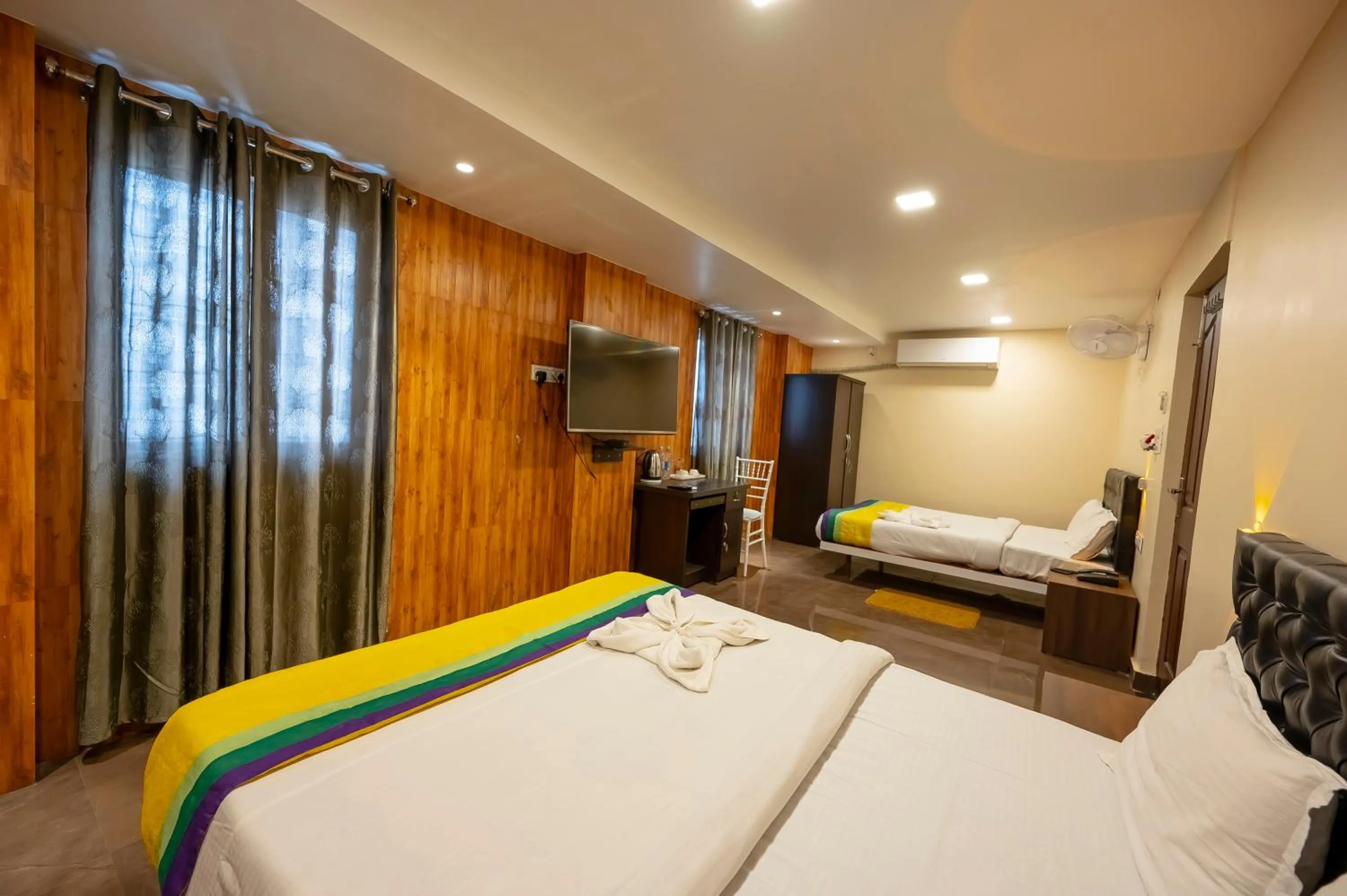 Bed in HOTEL MITTAL GARDEN