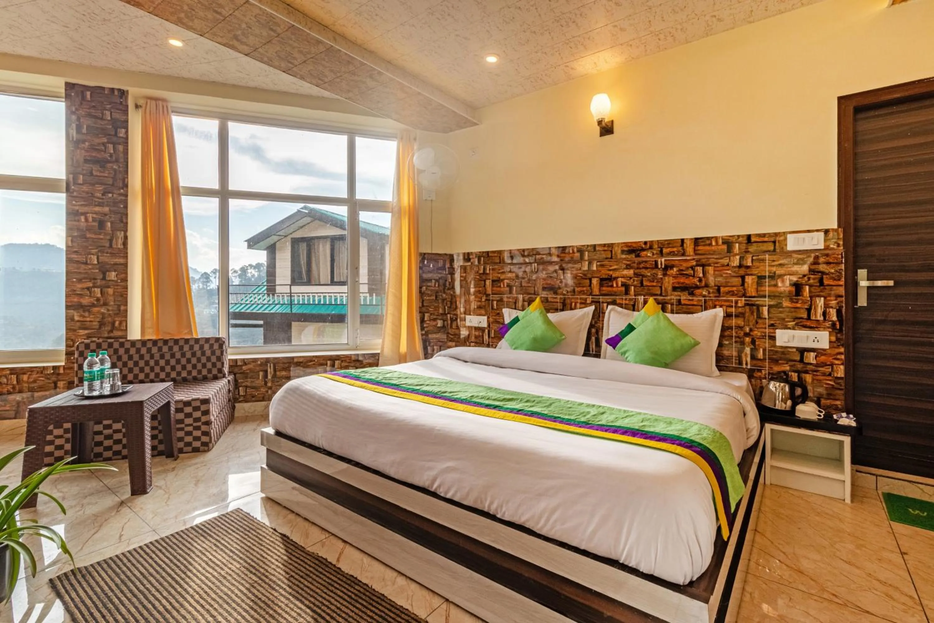 Bedroom in Treebo Srishti Vaikunth With Mountain View