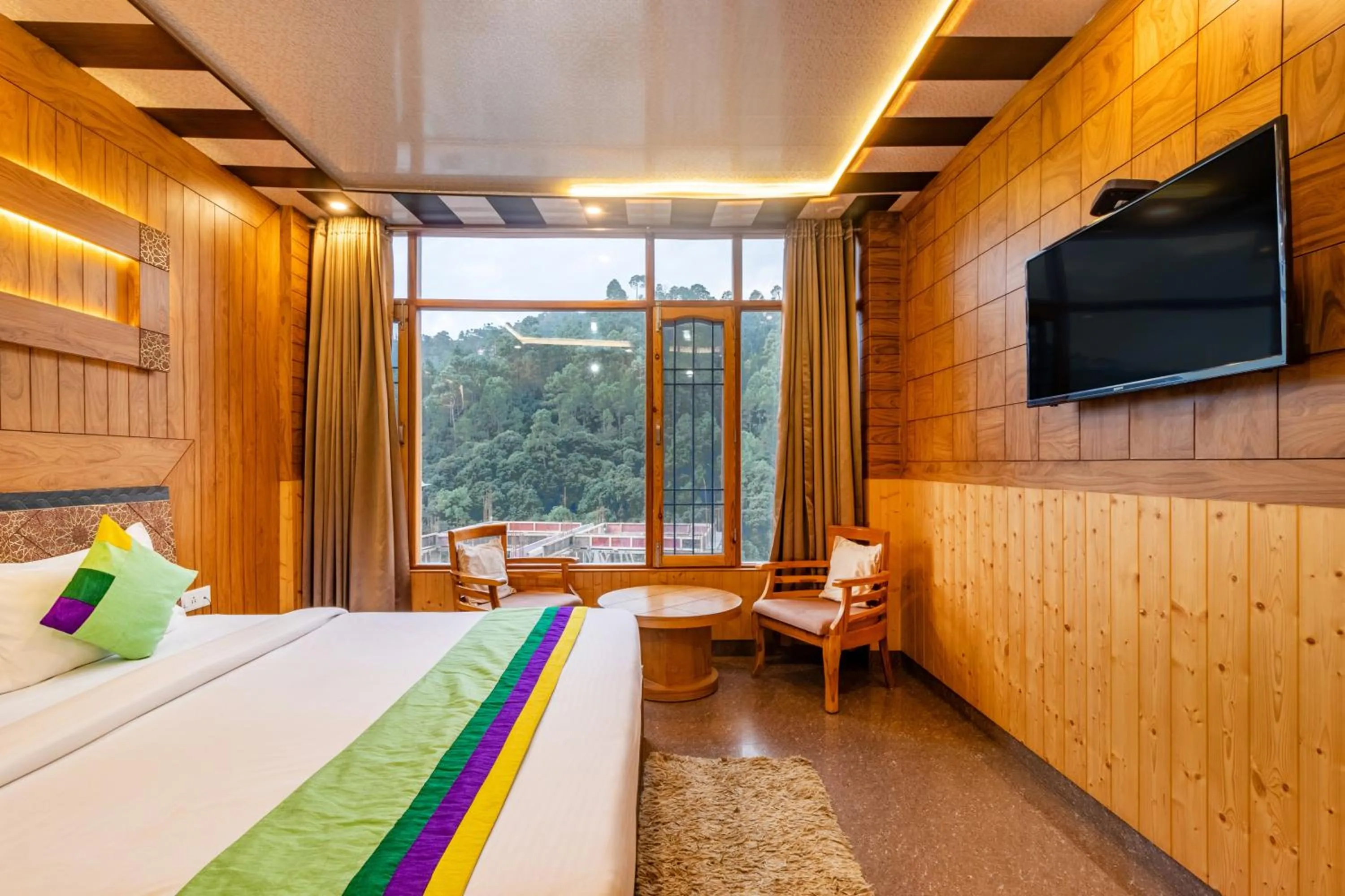 Bedroom in Treebo Srishti Vaikunth With Mountain View