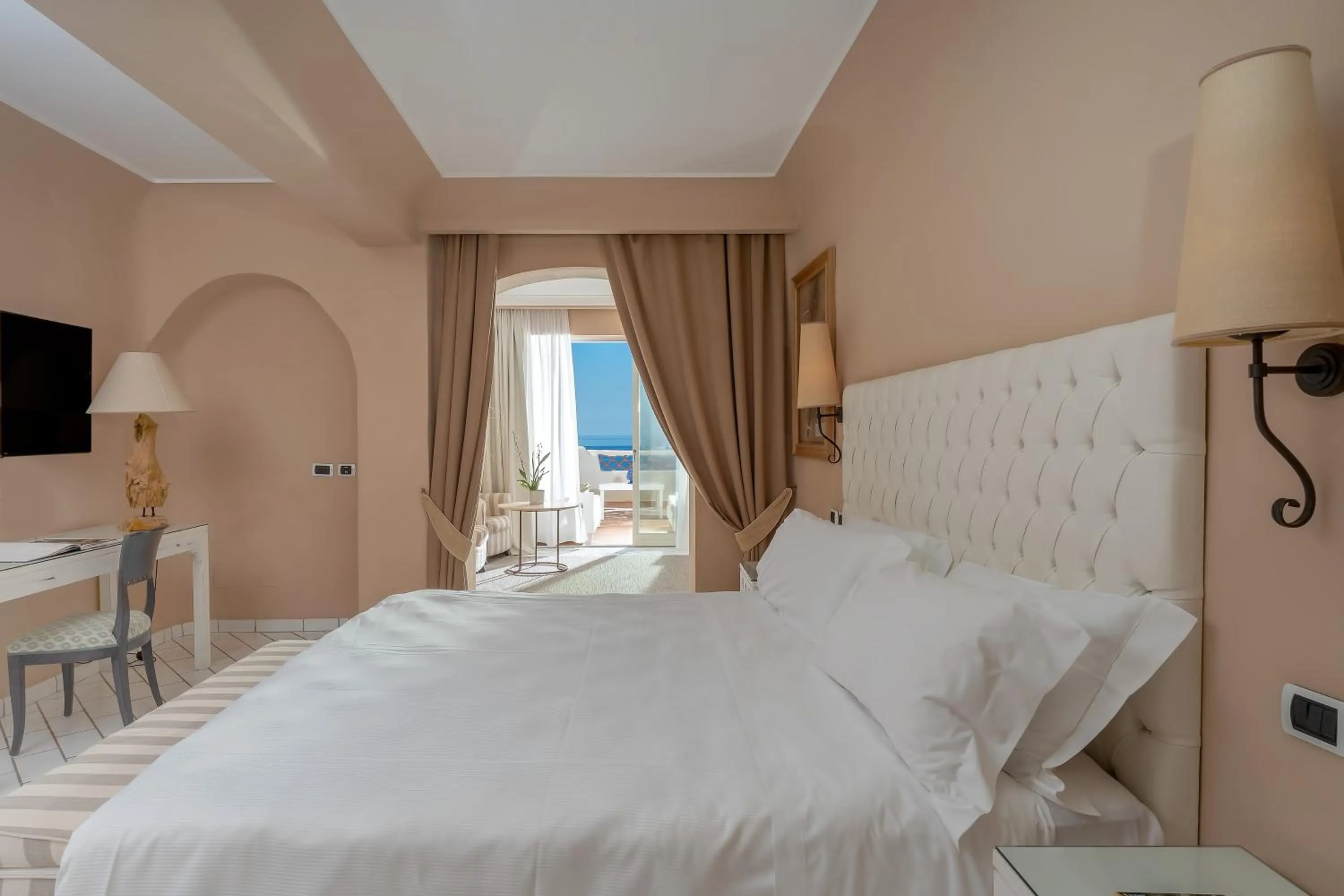 Bed in Therasia Resort Sea and SPA - The Leading Hotels of the World