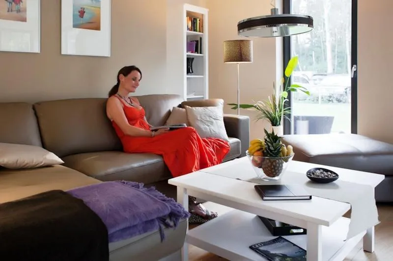 Living room in FW Huflattich - Sauna, Kamin & Terrasse