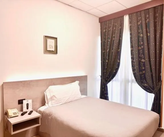 Bed in Hotel Leonardo