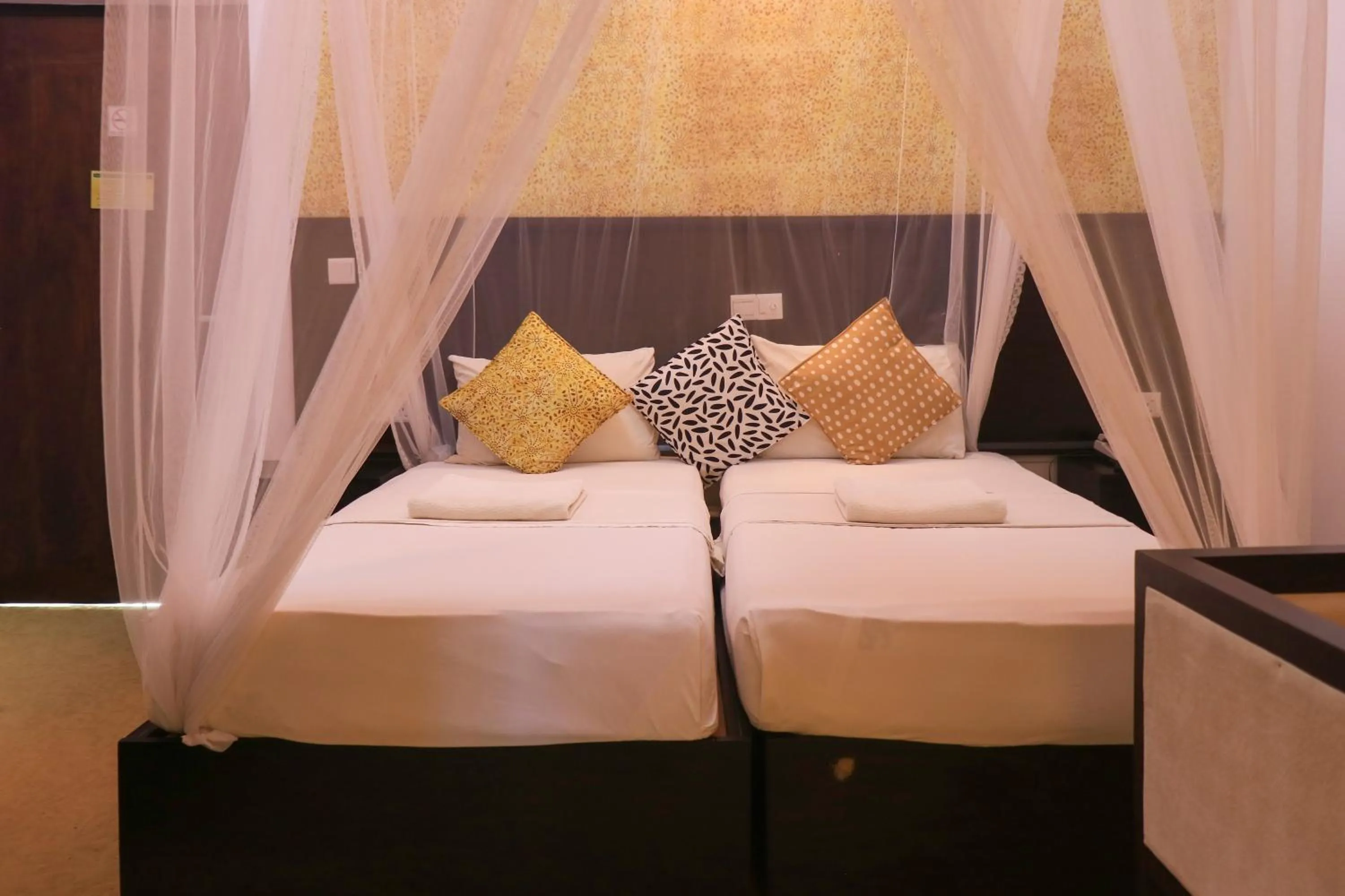 Bed in Thissa Inn Hotel