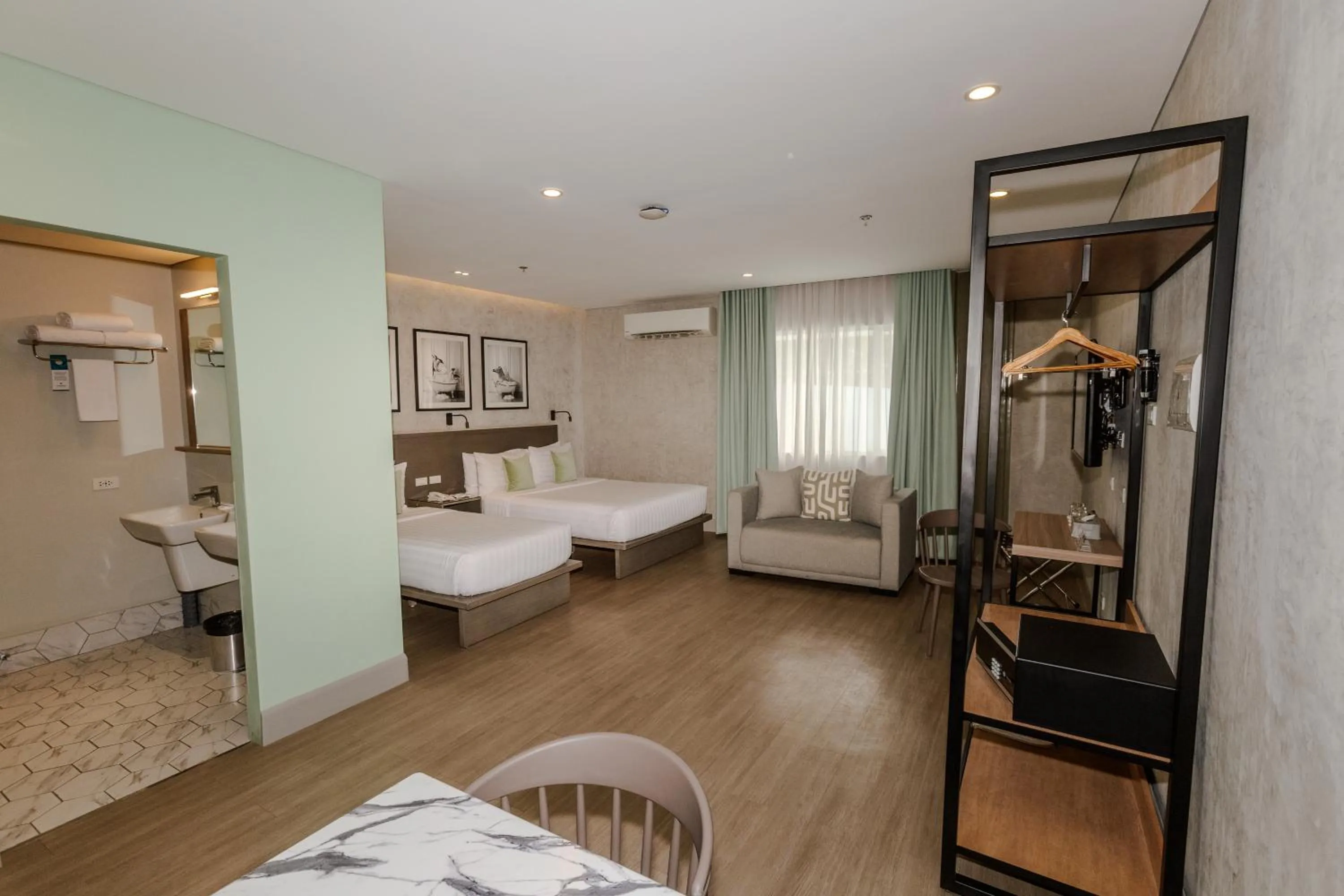 Photo of the whole room, Bed in Primeway Suites Cebu