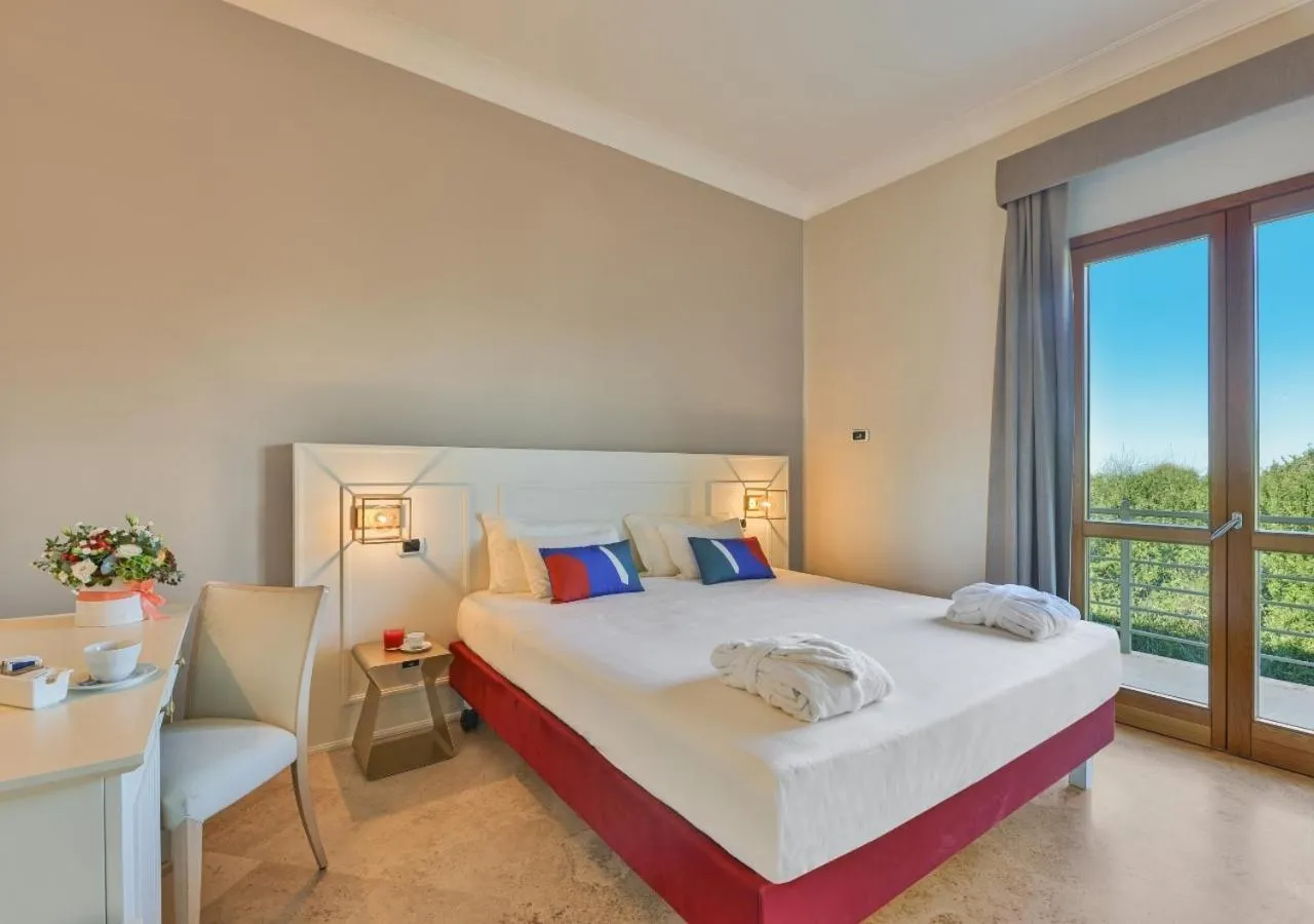 Bed in Tombolo Talasso Resort