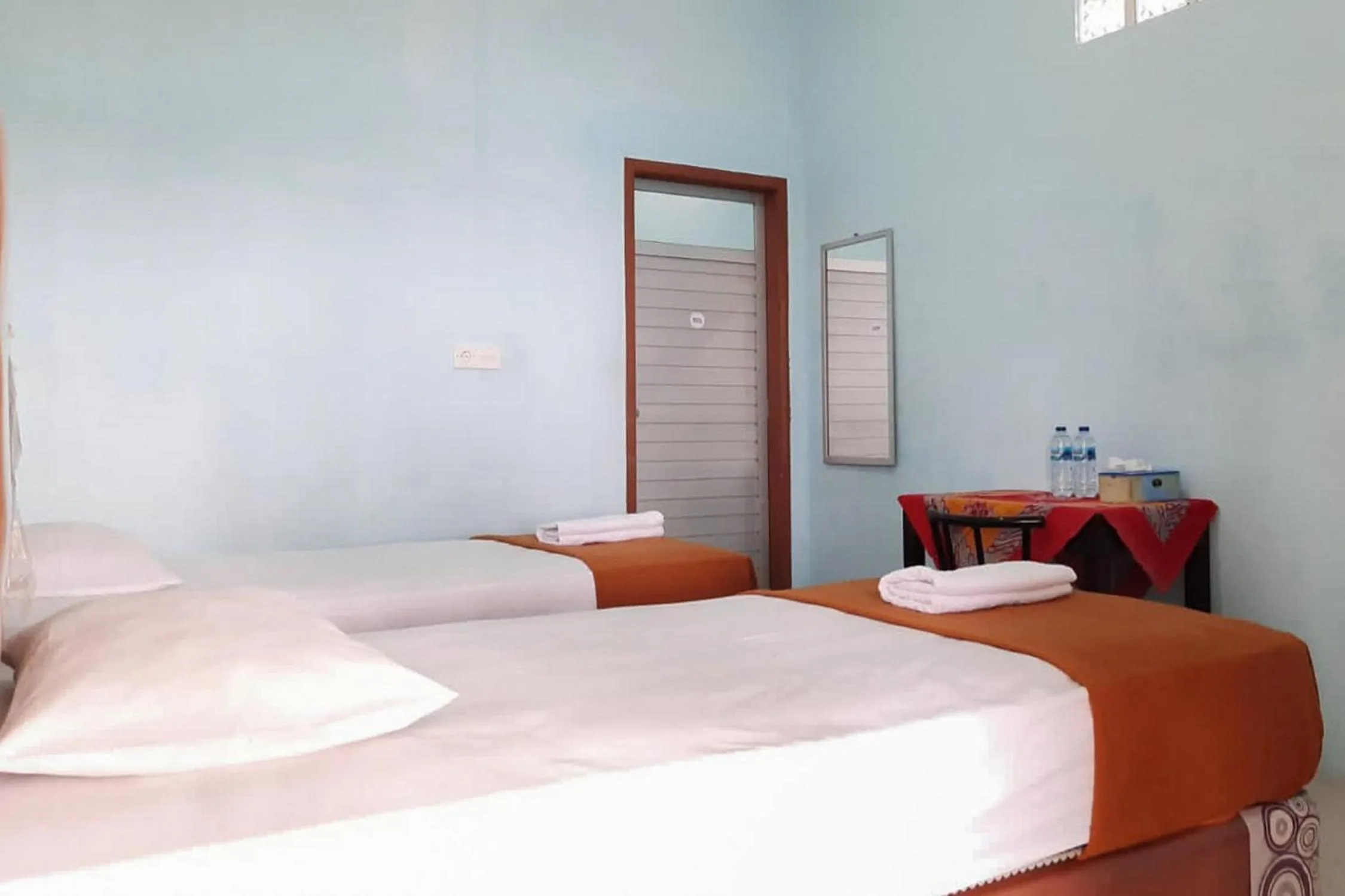 Bed in Prima Homestay Mentawai Mitra RedDoorz