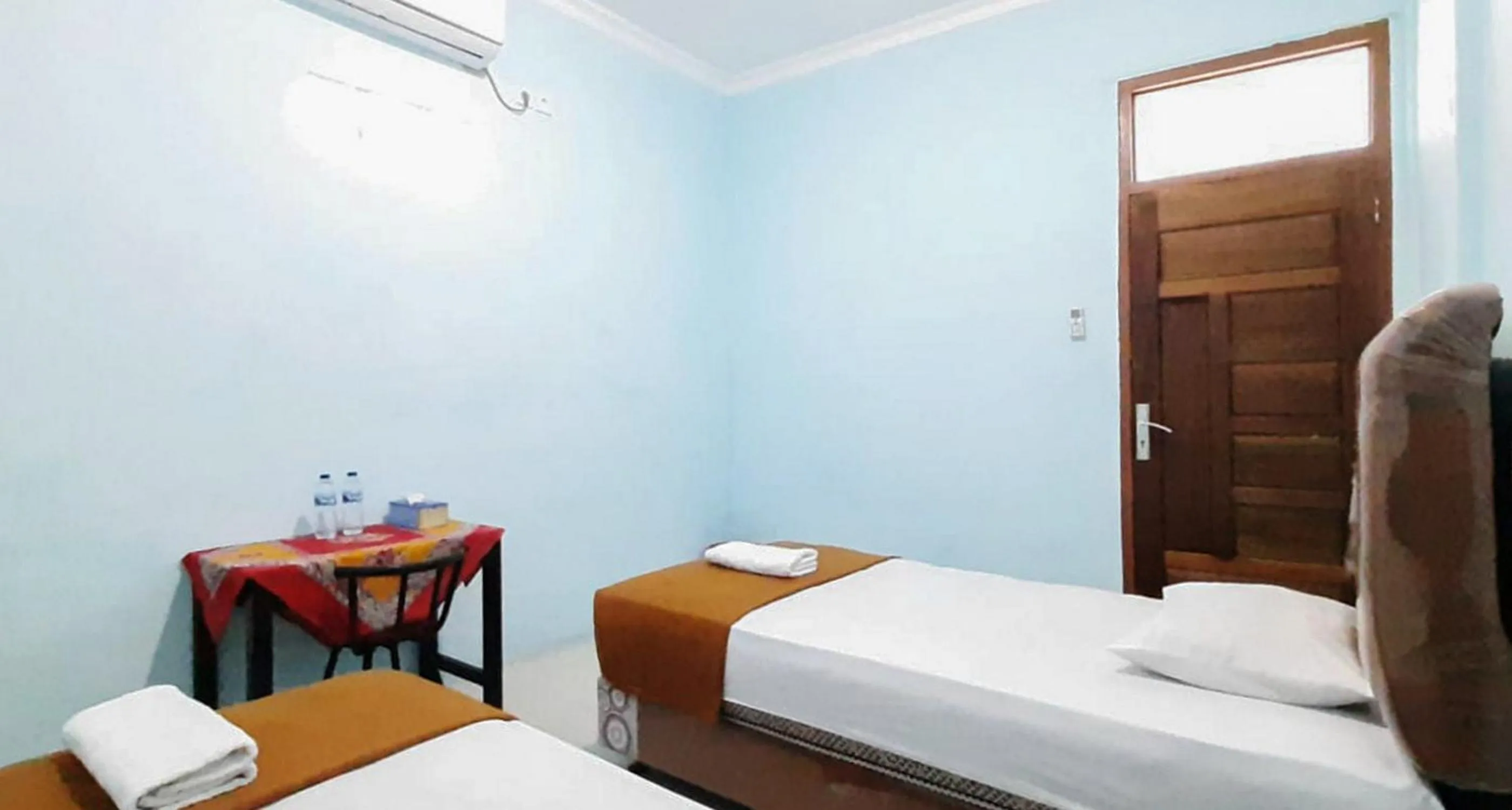 Bed in Prima Homestay Mentawai Mitra RedDoorz