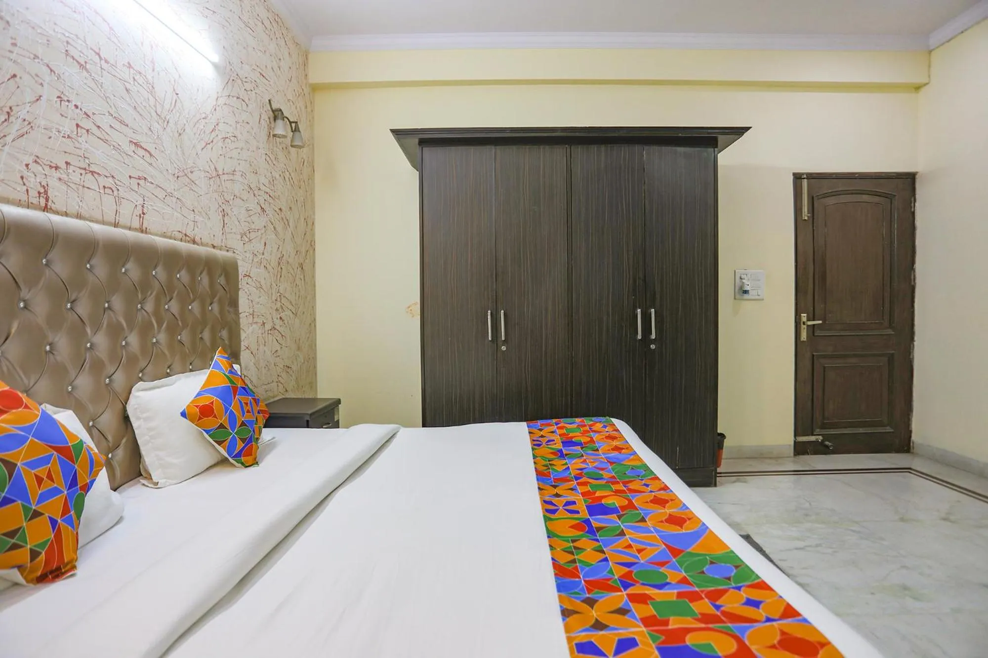 Bed in FabHotel HM Palace