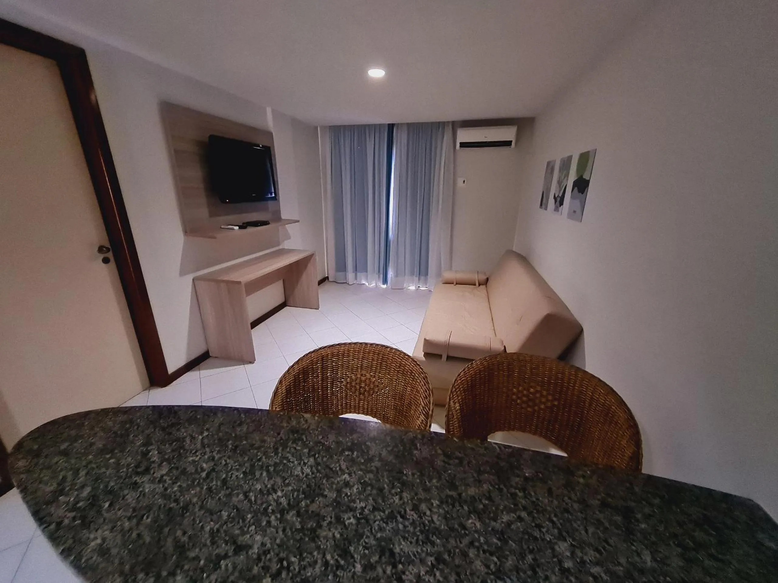 Living room, Bed in Ambassador Unidades Autônomas