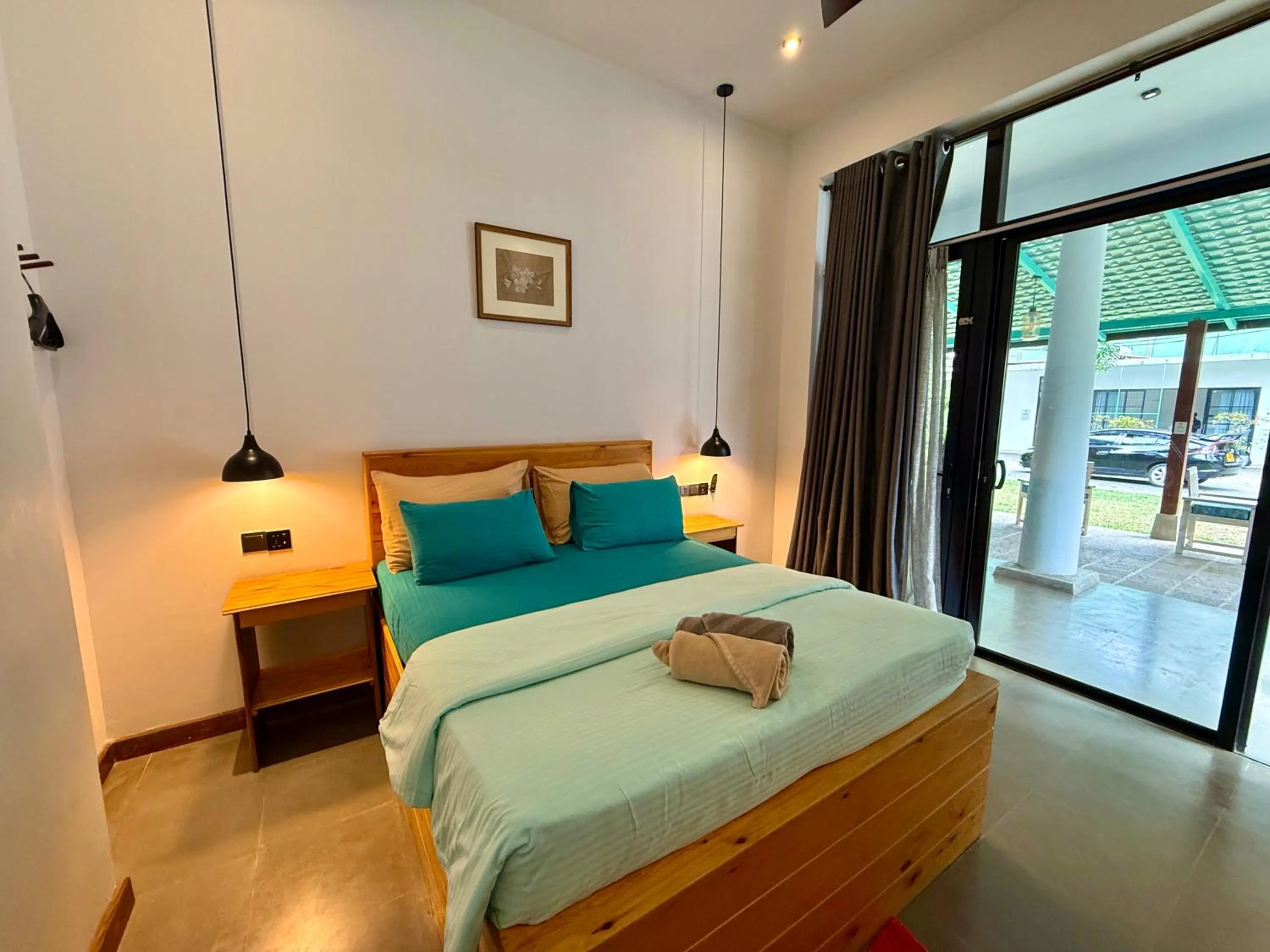 Bed in Ella Inn Hotel