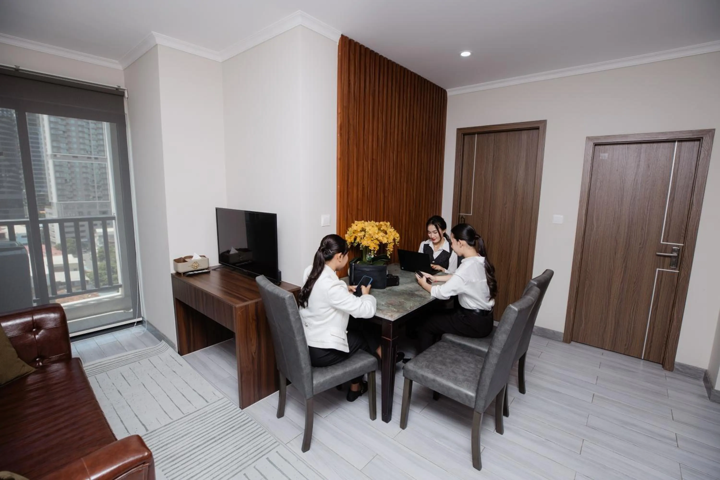 Communal lounge/ TV room in The ONRA Hotel