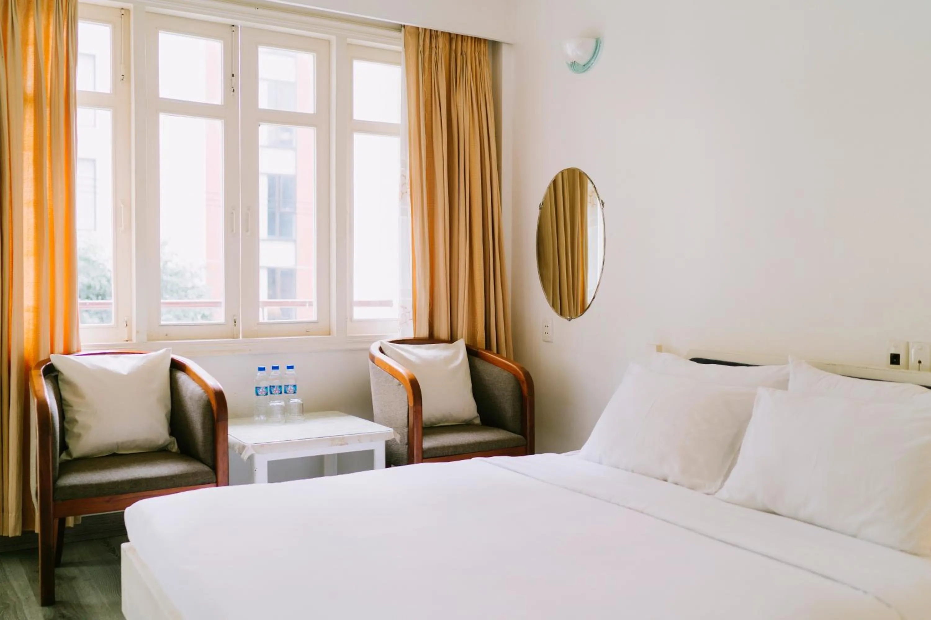 Seating area, Bed in Mercury Hotel & Apartment