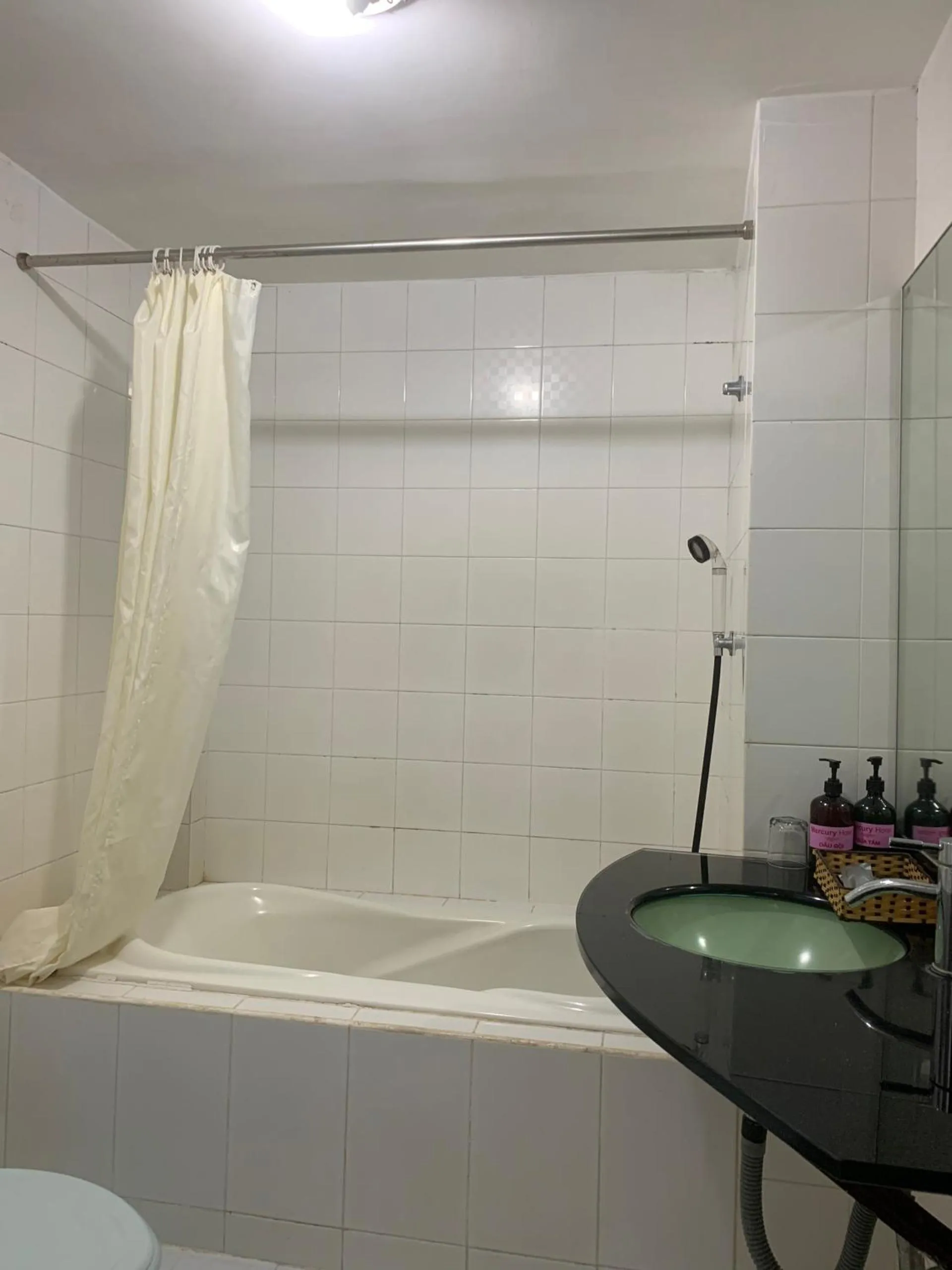 Bathroom in Mercury Hotel & Apartment