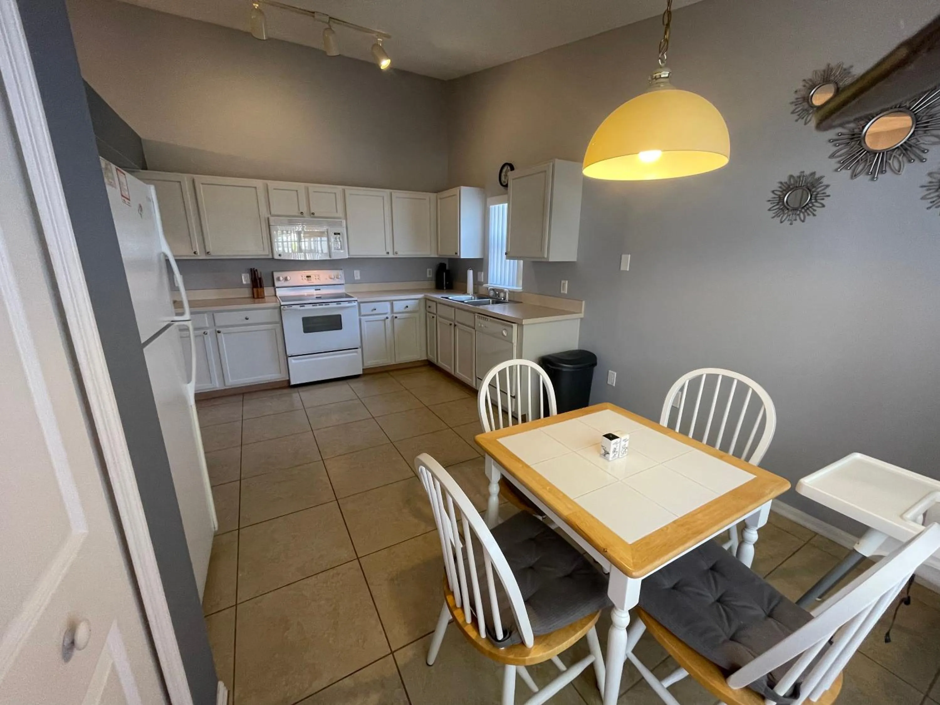 Kitchen or kitchenette in 3 Bedroom Villa with Poolside Cinema and Games Room Close to theme Parks sleeps 6 plus 2