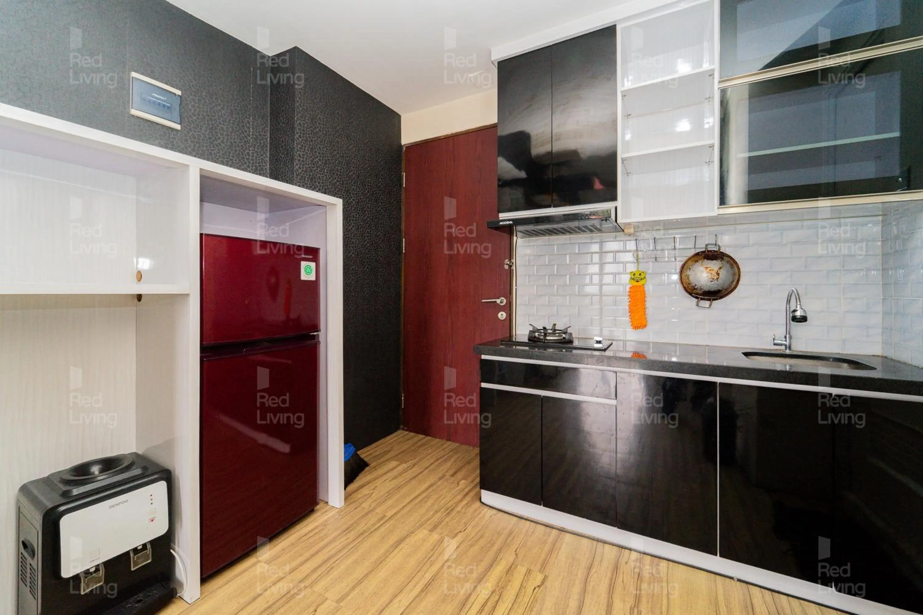 Kitchen or kitchenette in RedLiving Apartemen Tamansari Panoramic - Santuy Agency
