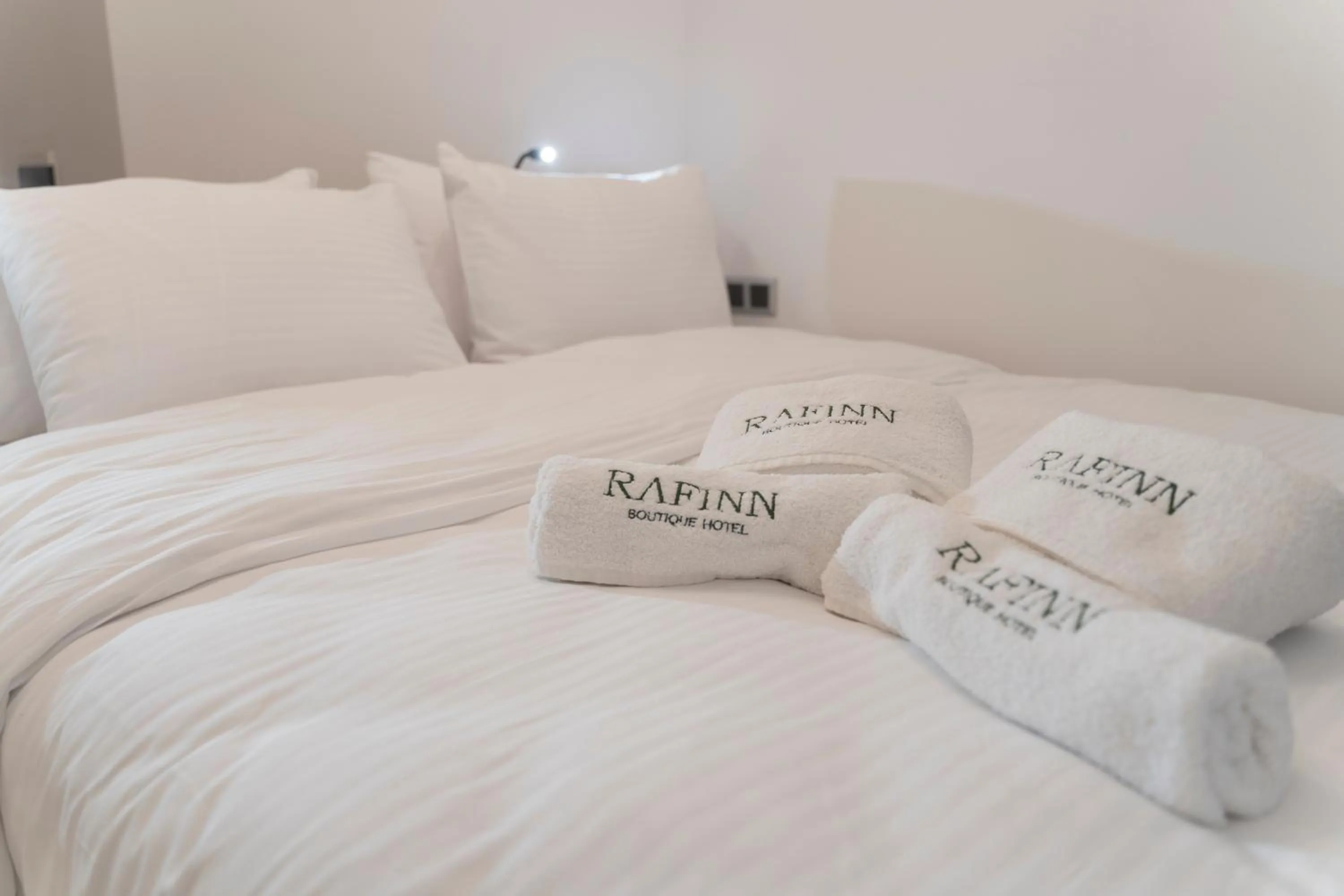 Bed in Rafinn Hotel