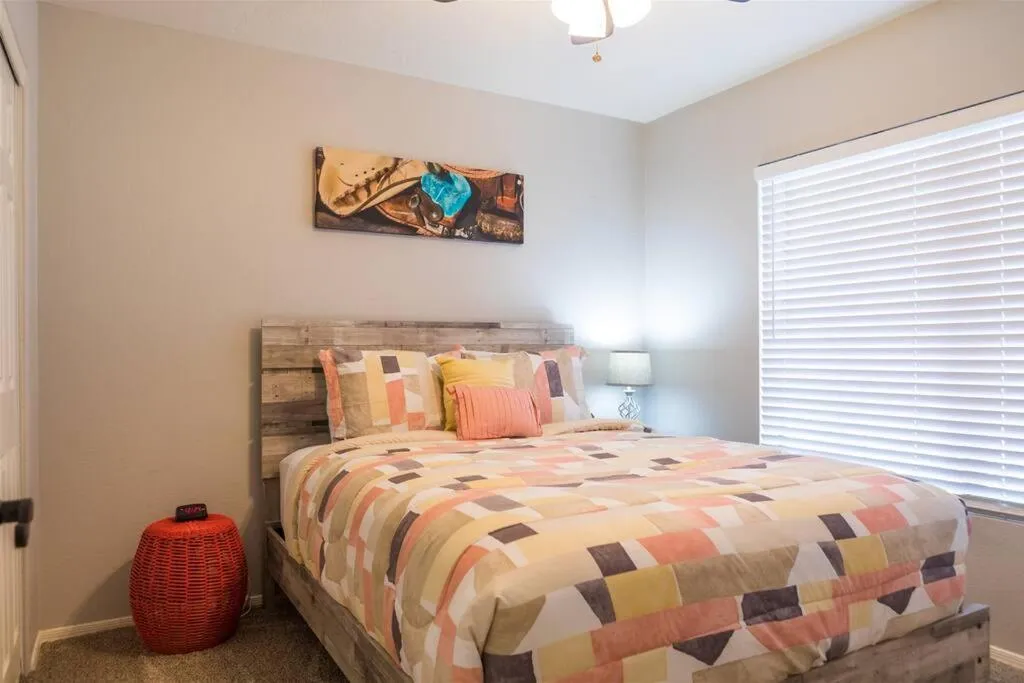 Bed in Cozy home with pool, fire table, BBQ, RV parking