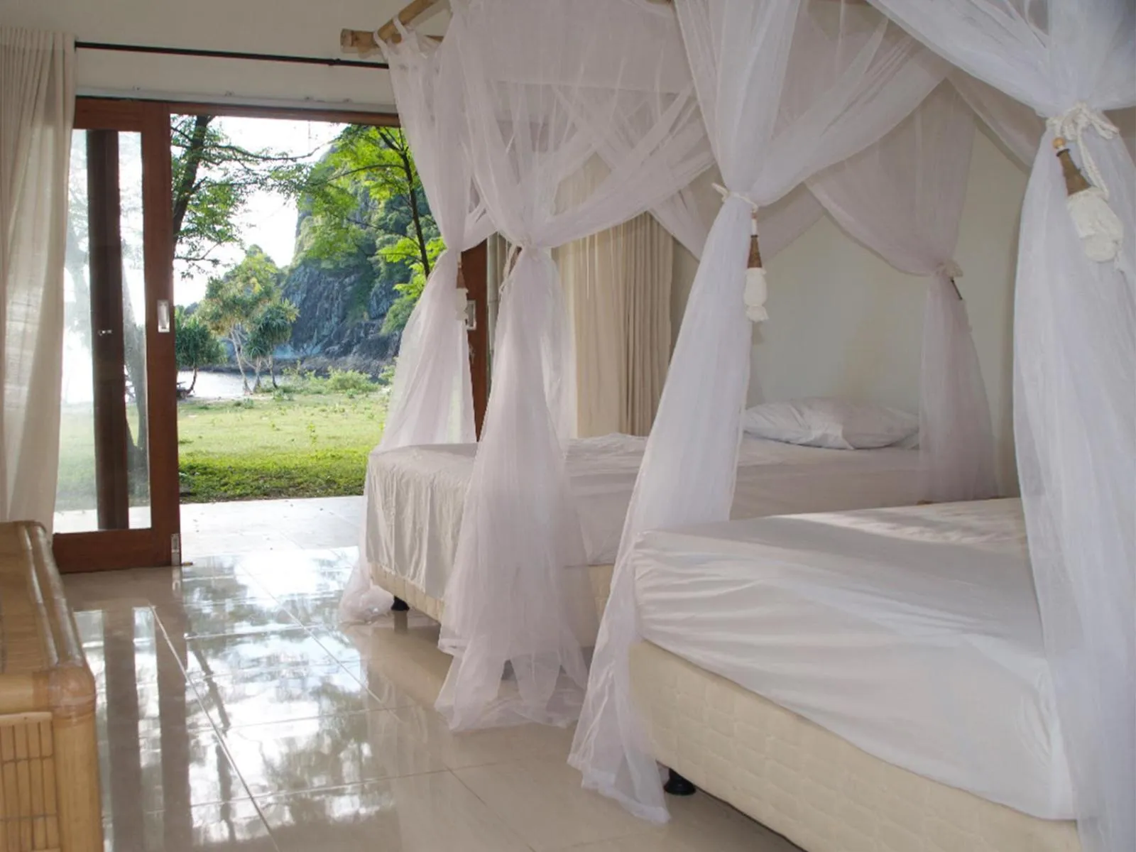 Bed in Kirana Retreat - Beach Front Resort