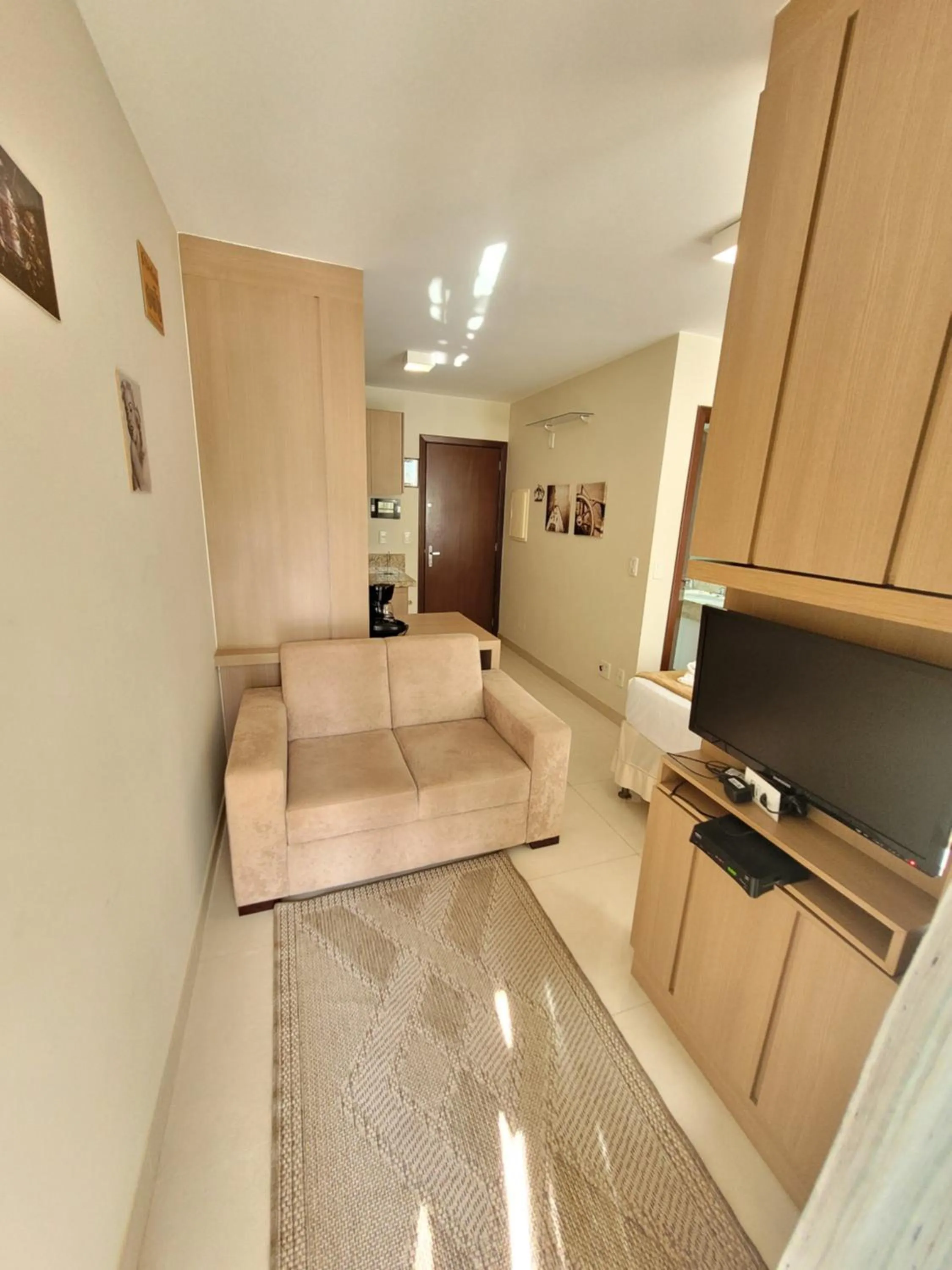 Communal lounge/ TV room in The Sun Resort By Rei dos Flats