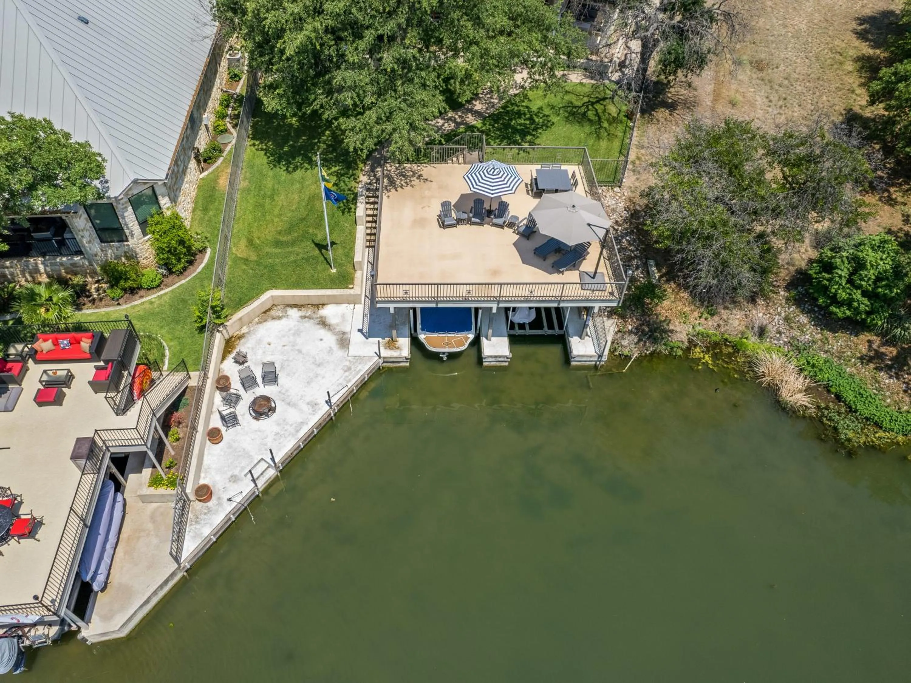 Waterfront Home with Boat Slip, Spacious Outdoor Patio and a Fenced Yard