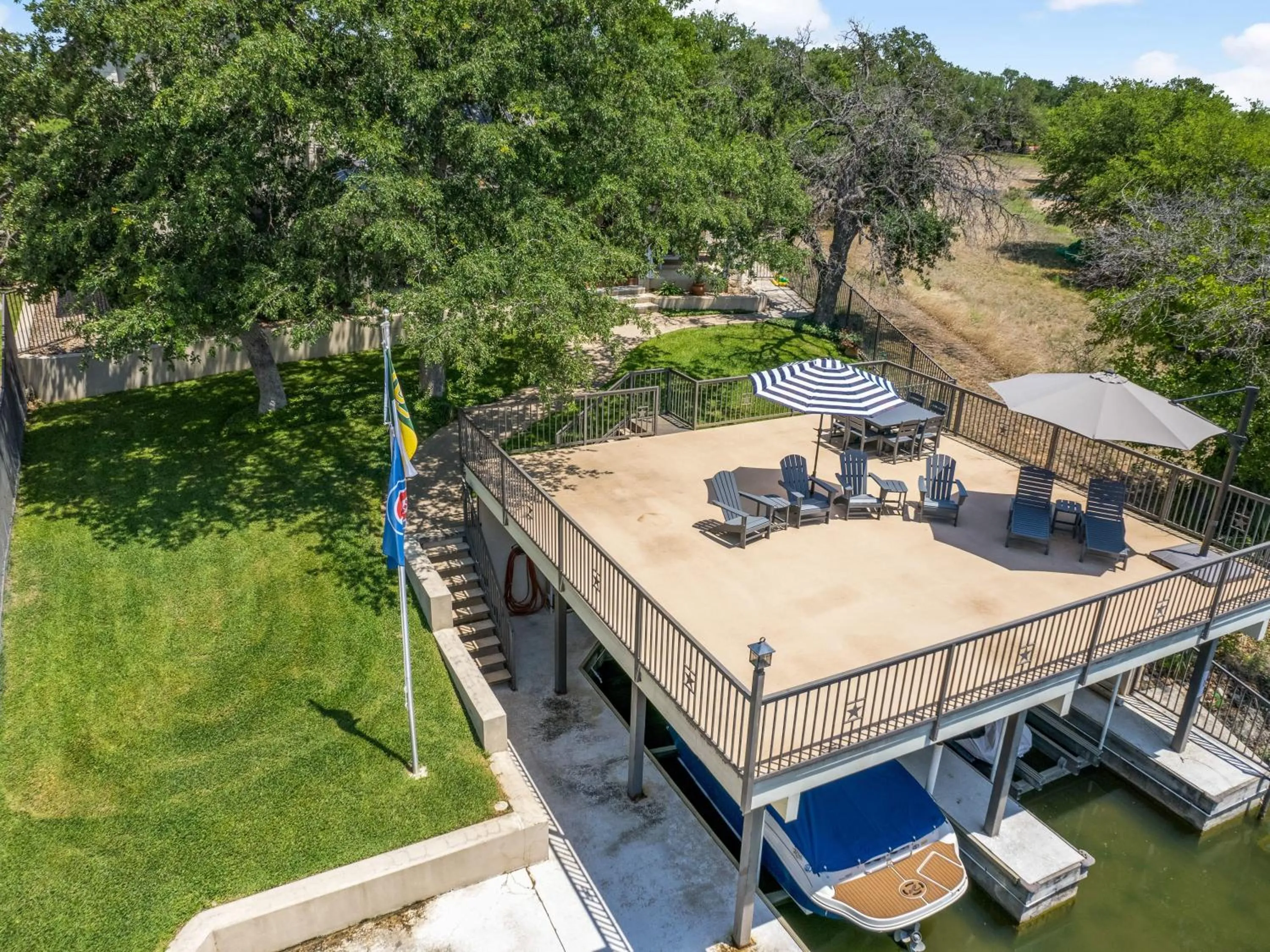 Waterfront Home with Boat Slip, Spacious Outdoor Patio and a Fenced Yard