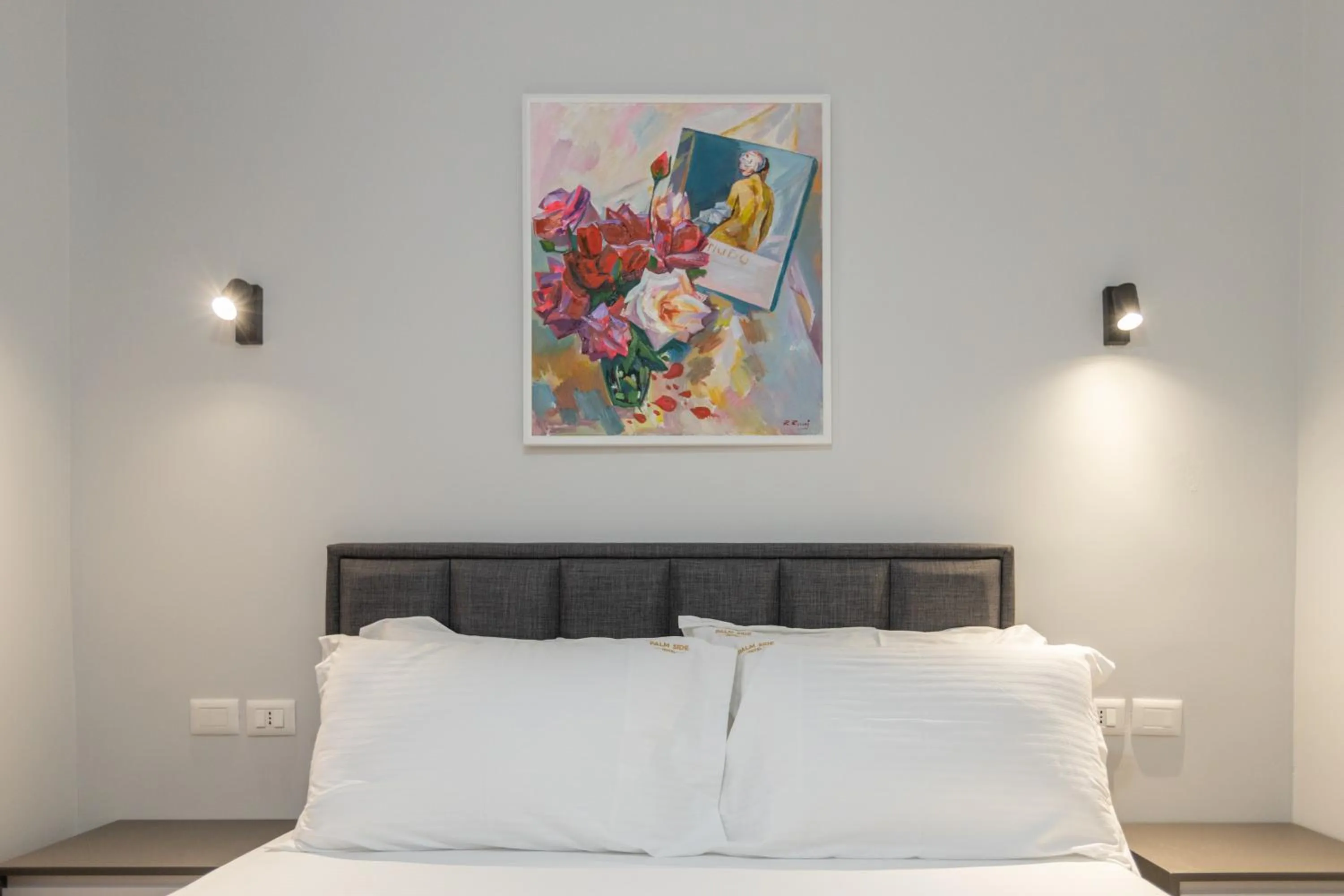 Bed in Palm Side Hotel