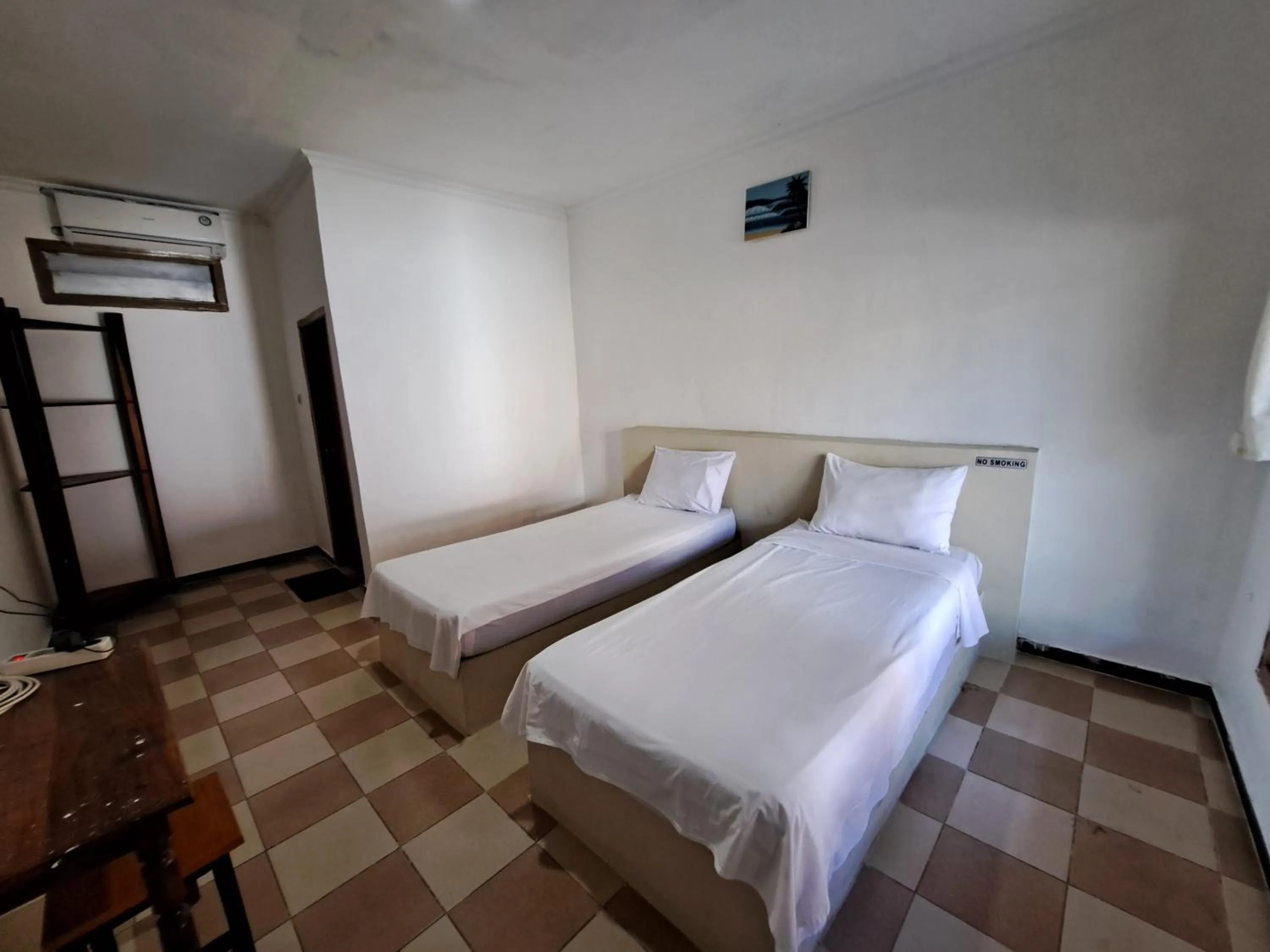 Bed in Surfers Beachfront Lombok