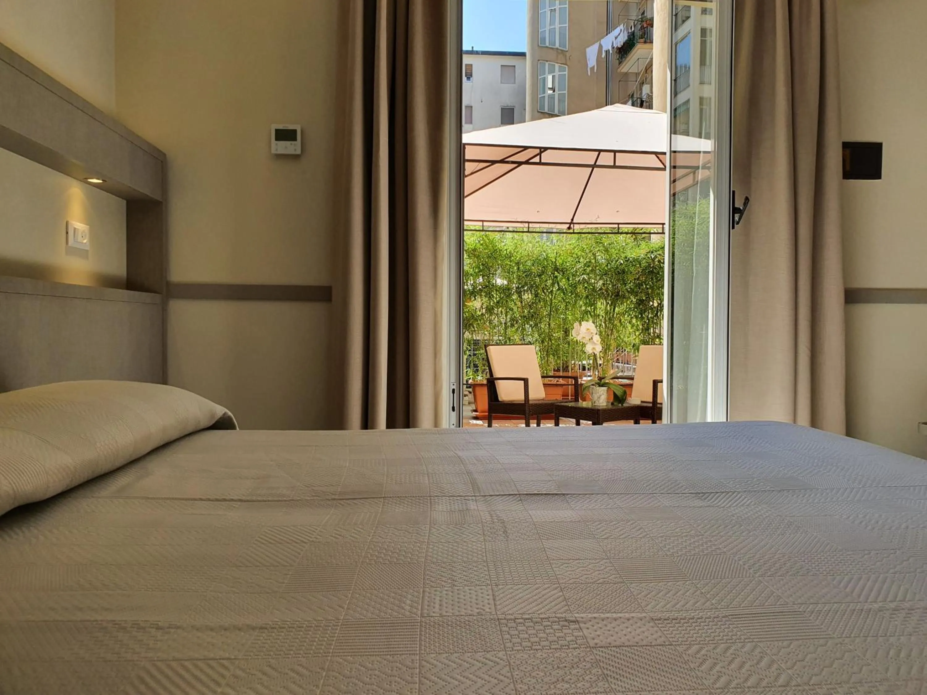 Patio, Bed in Hotel Corallo
