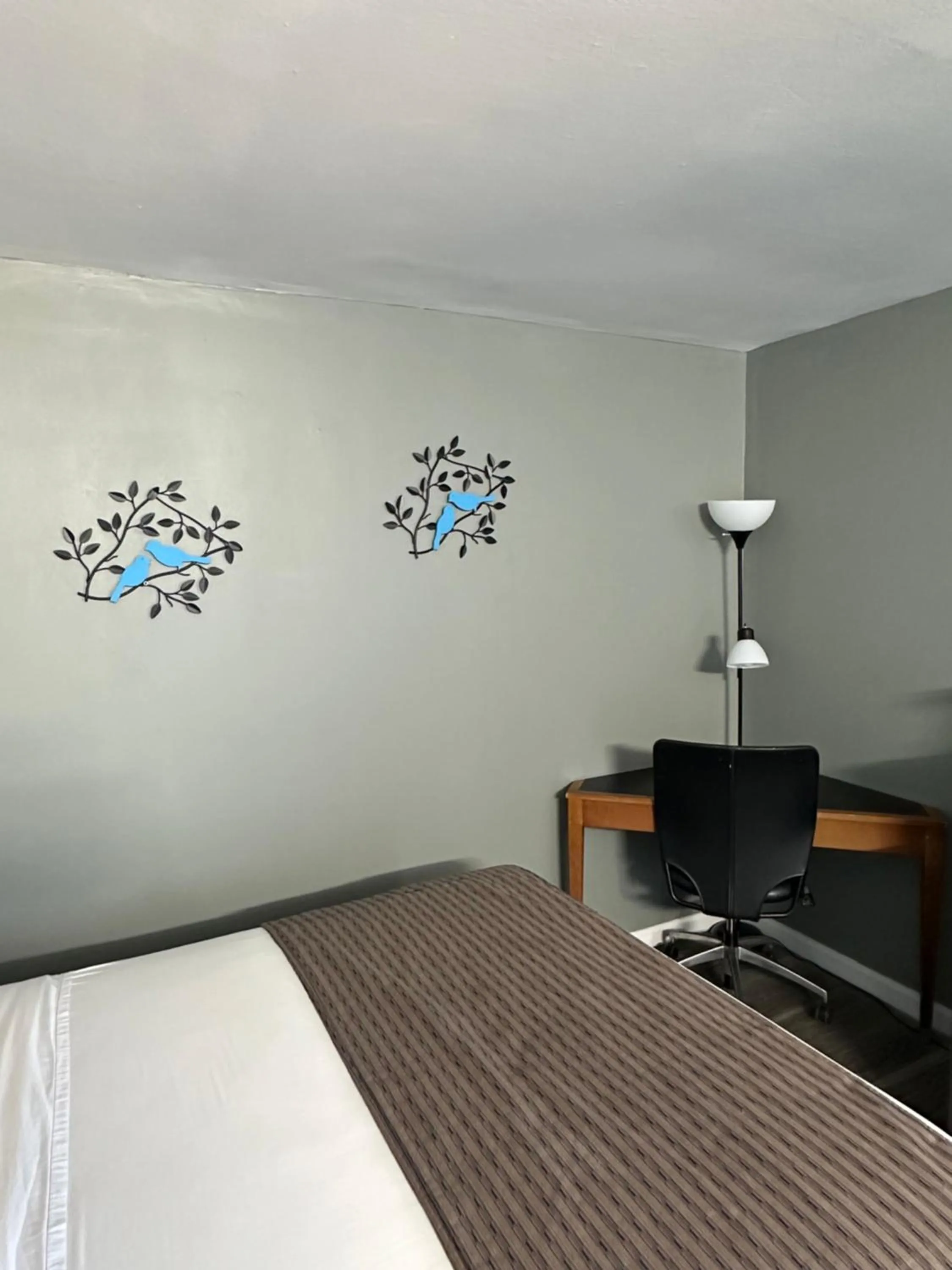 Bed in Travel Inn & Suites