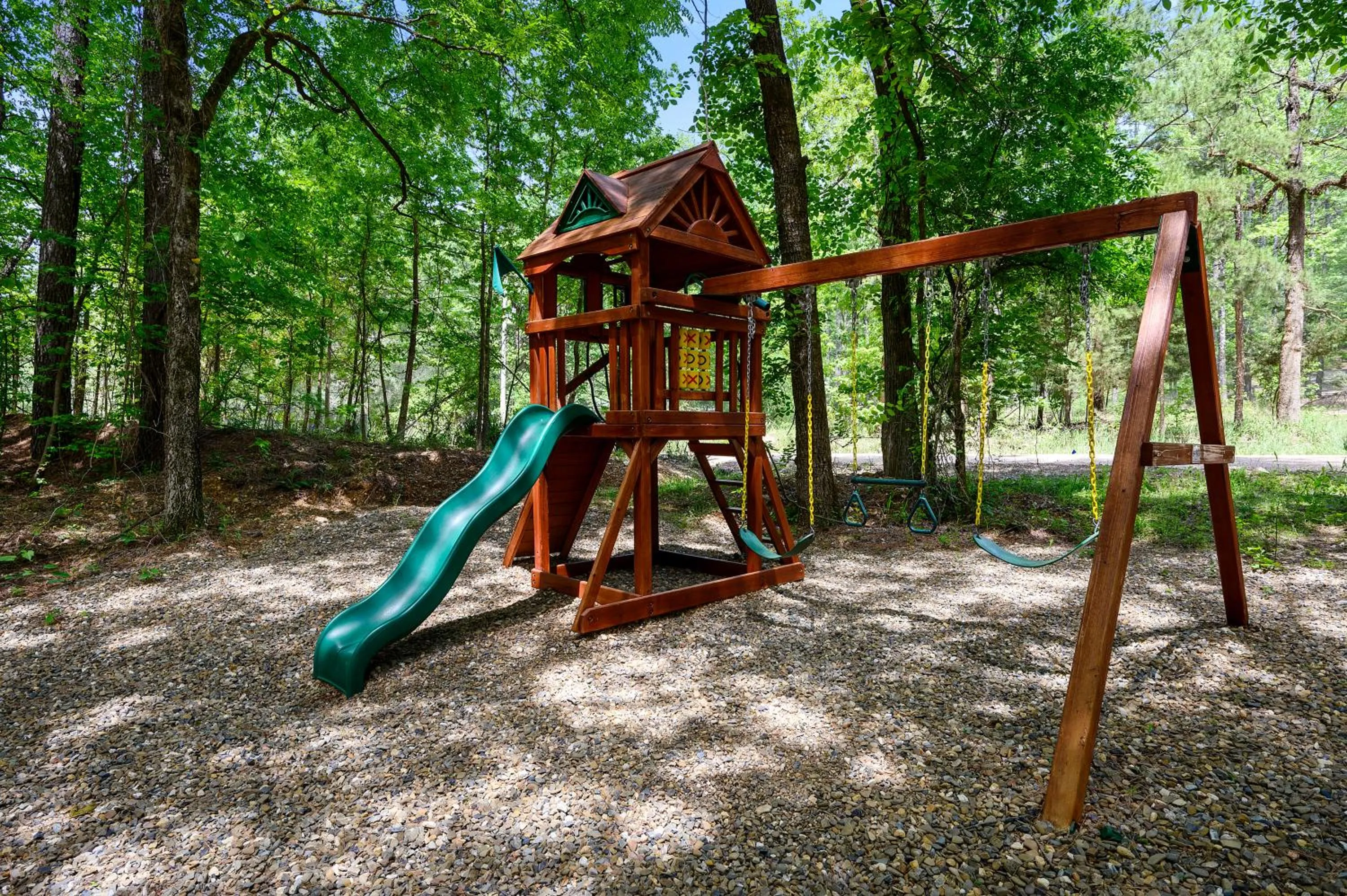 Children play ground in Hickory Bear - Cabin surrounded by pines, Sleeps 10, Hot Tub, Fire Pit, Arcade, Foosball Table & Deck Slide