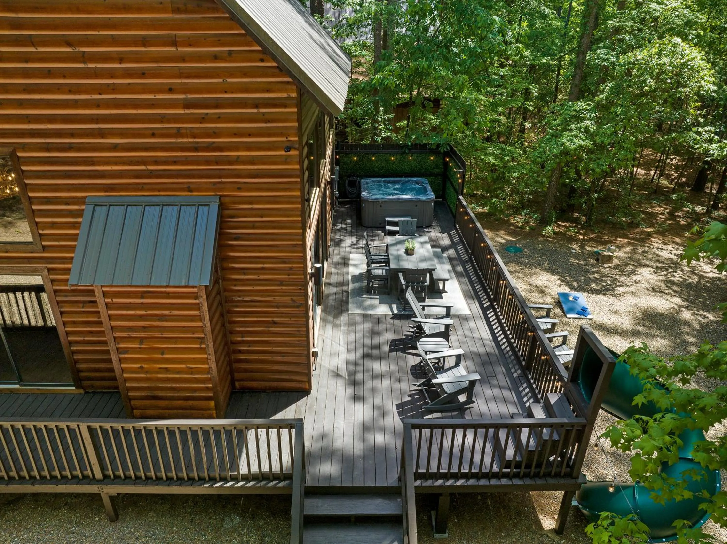 Property building in Hickory Bear - Cabin surrounded by pines, Sleeps 10, Hot Tub, Fire Pit, Arcade, Foosball Table & Deck Slide