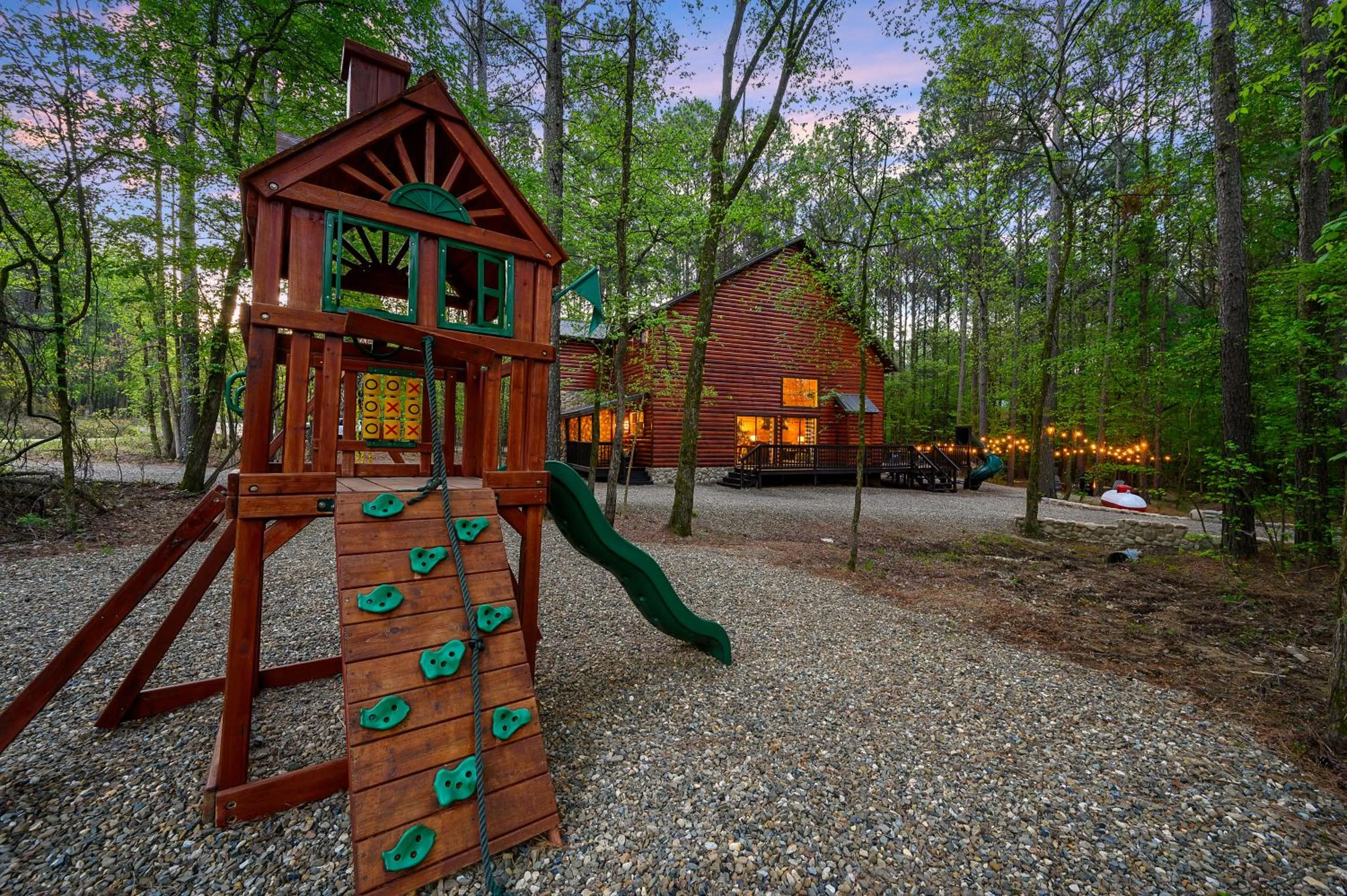 Children play ground in Hickory Bear - Cabin surrounded by pines, Sleeps 10, Hot Tub, Fire Pit, Arcade, Foosball Table & Deck Slide