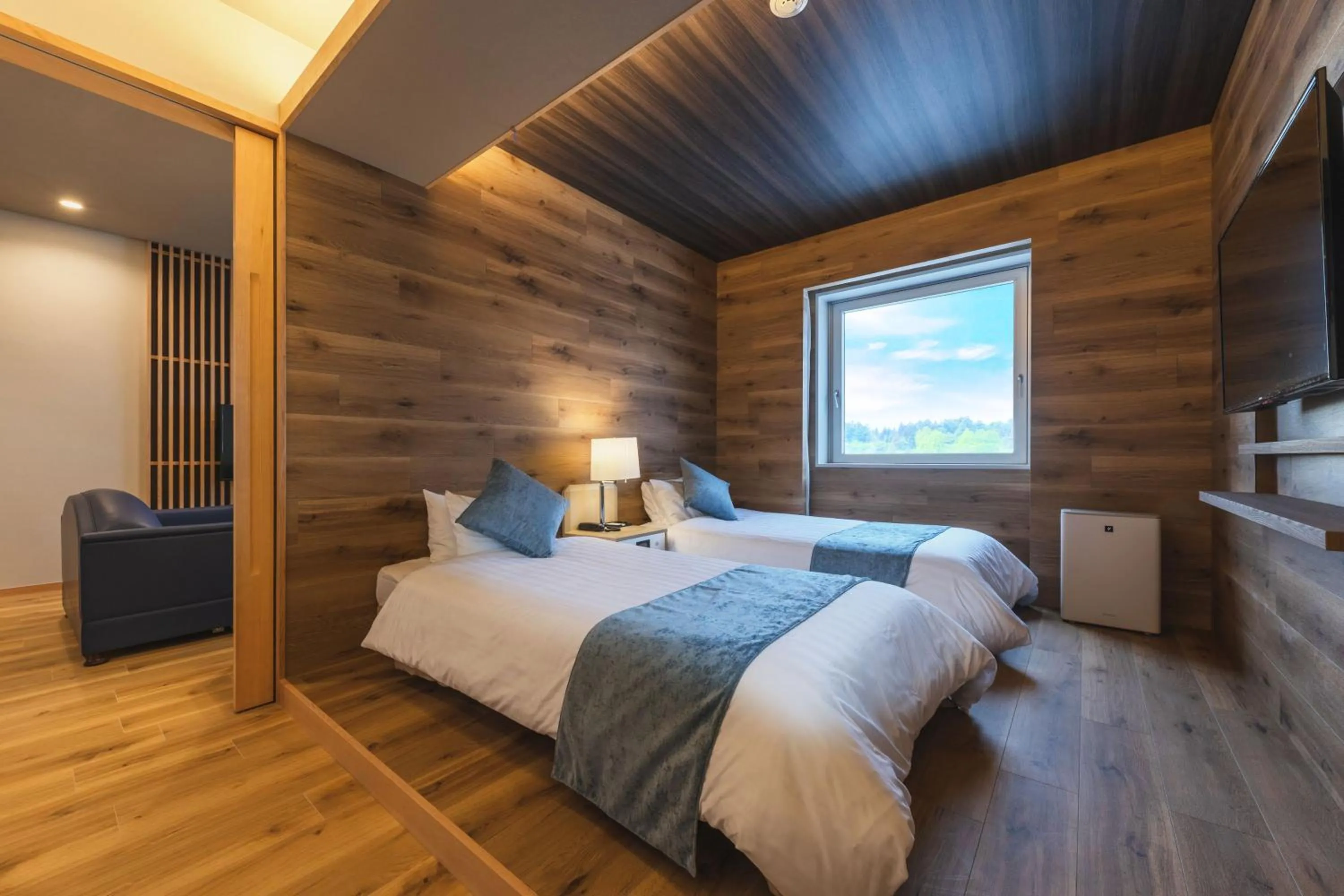 Bed in Takamiya Hotel Rurikura Resort