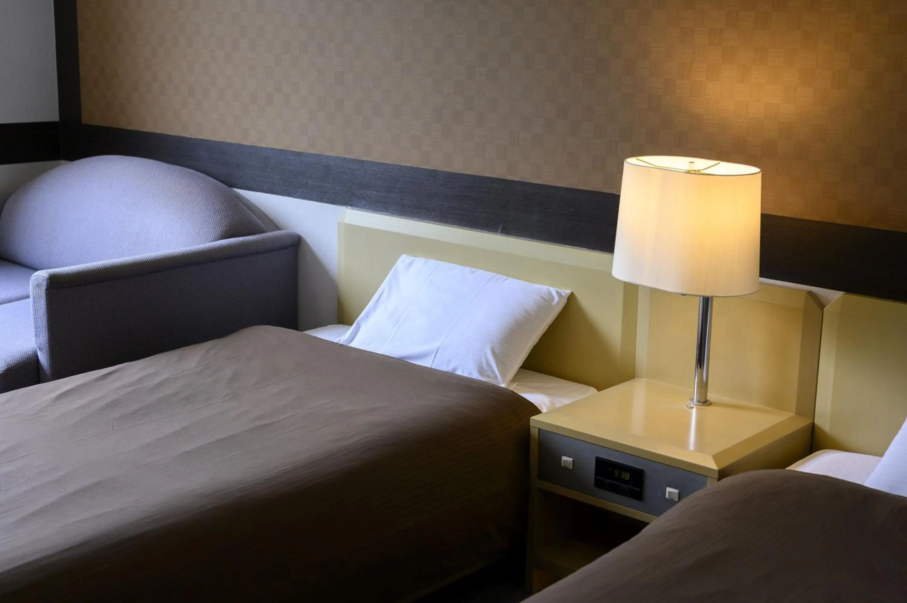 Bed in Takamiya Hotel Rurikura Resort