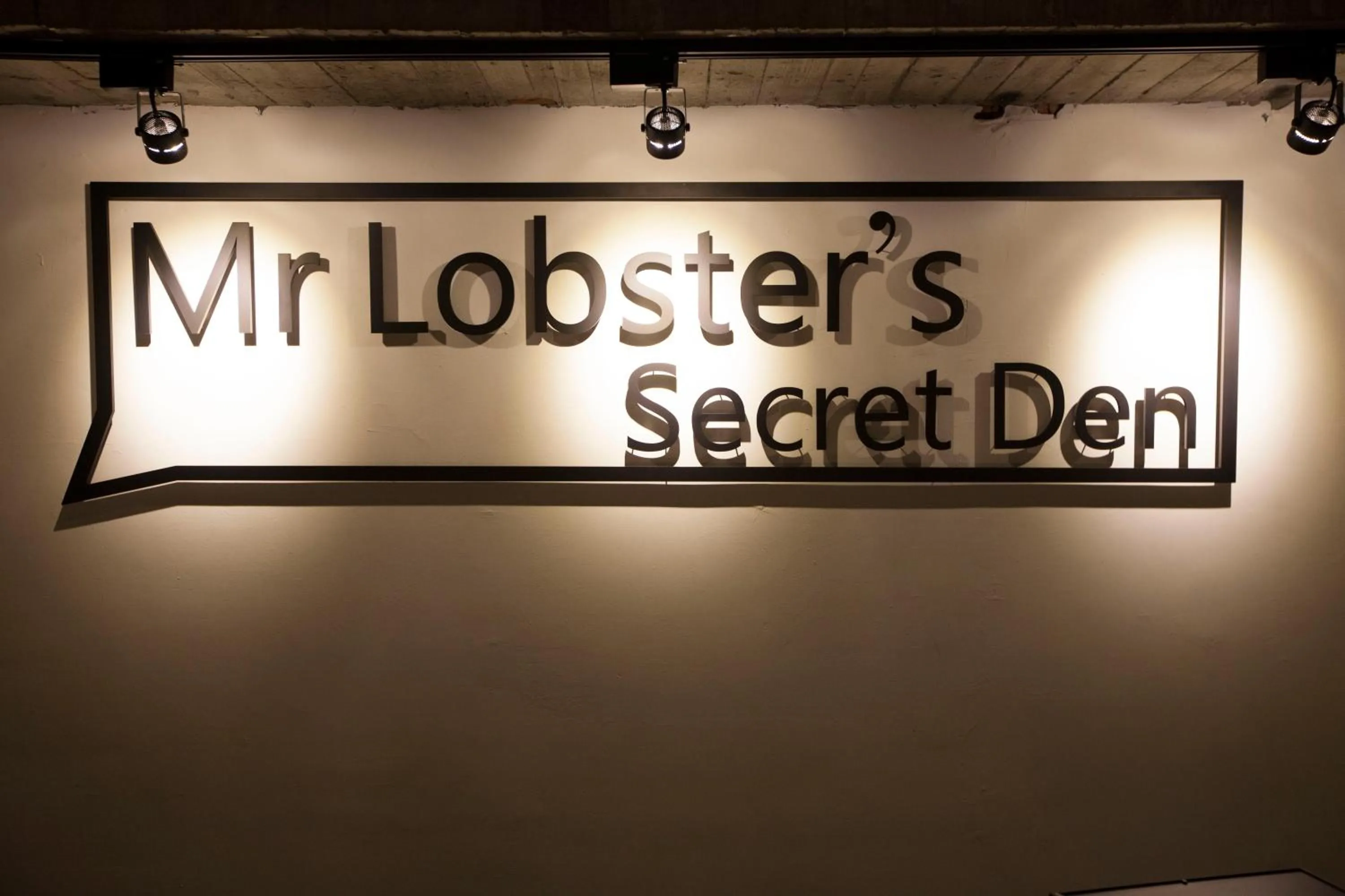 Property logo or sign in Mr. Lobster’s Secret Den design hostel