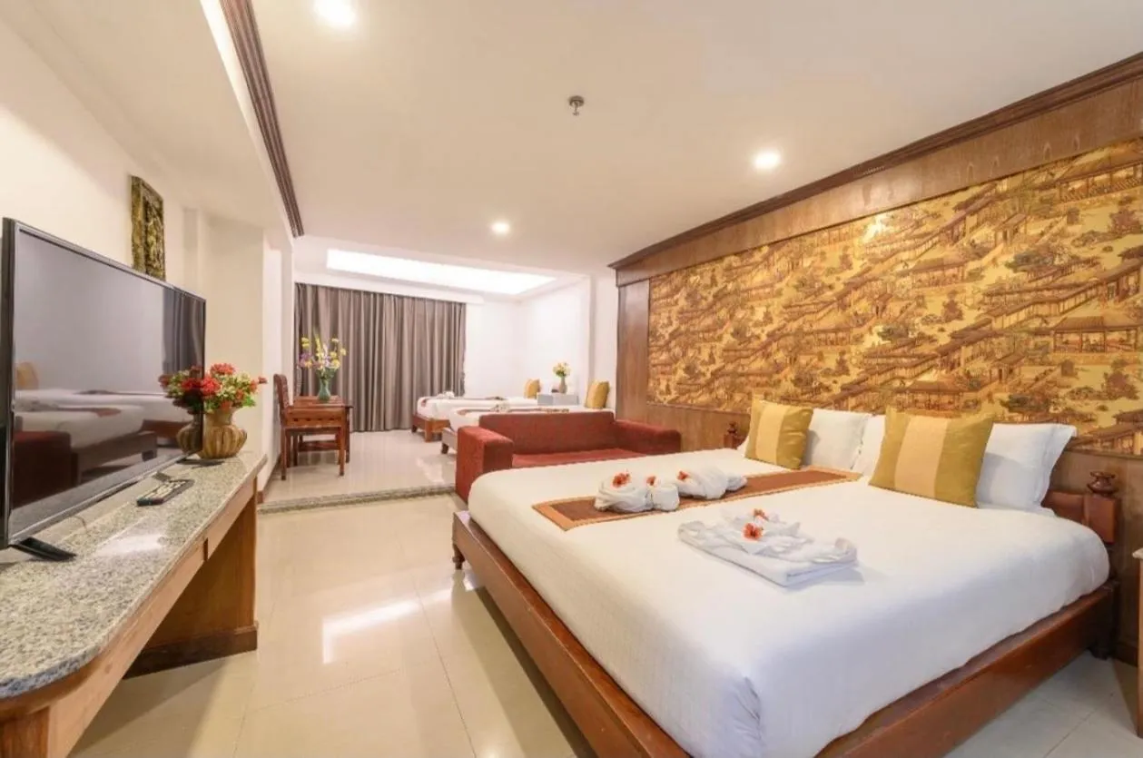 Communal lounge/ TV room, Bed in Boutique Paradise Hotel